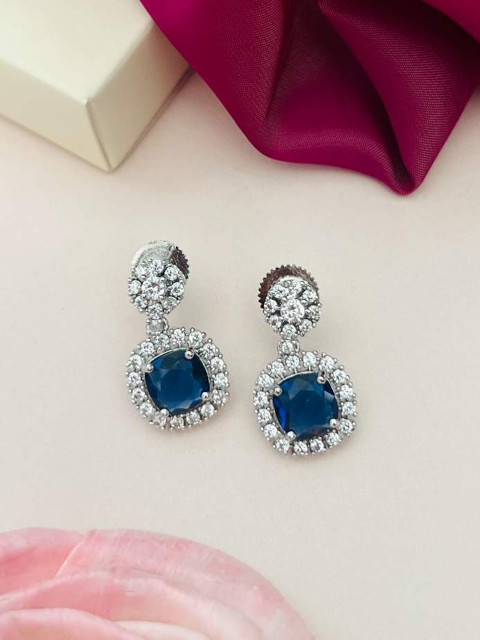 Abdesigns Jewellery Ruby Drop Earrings with Cubic Zirconia featuring blue stones surrounded by sparkling crystals