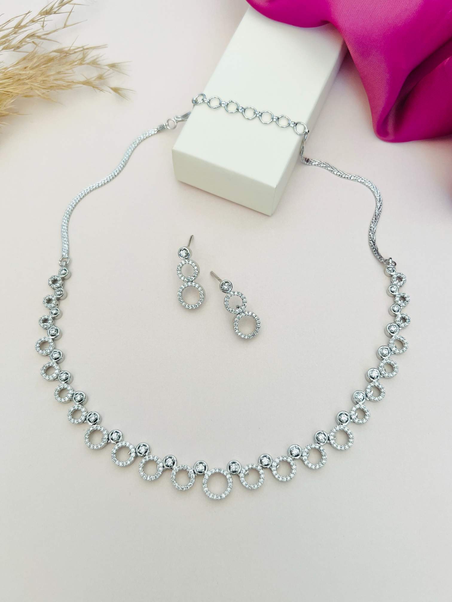 Abdesigns Jewellery Silver Circle Necklace Set with matching silver hoop earrings on display