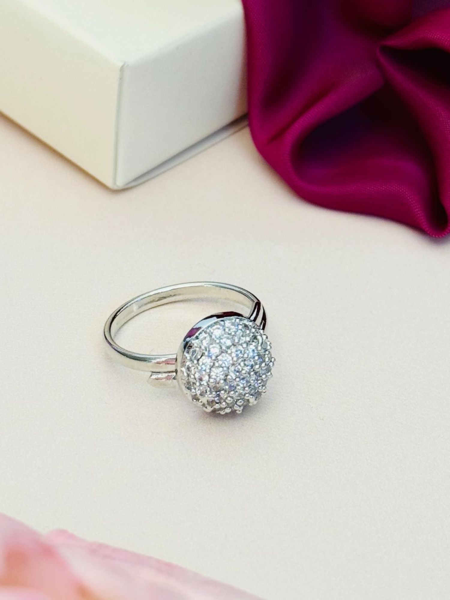 Abdesigns Jewellery Silver Fashion Ring with Stones sparkling pave dome on thin silver band on cream background