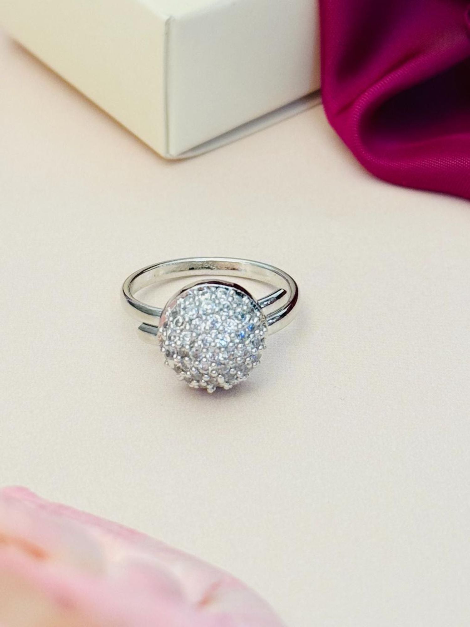 Abdesigns Jewellery Silver Fashion Ring with Stones. Silver pave dome ring on band displayed near white box