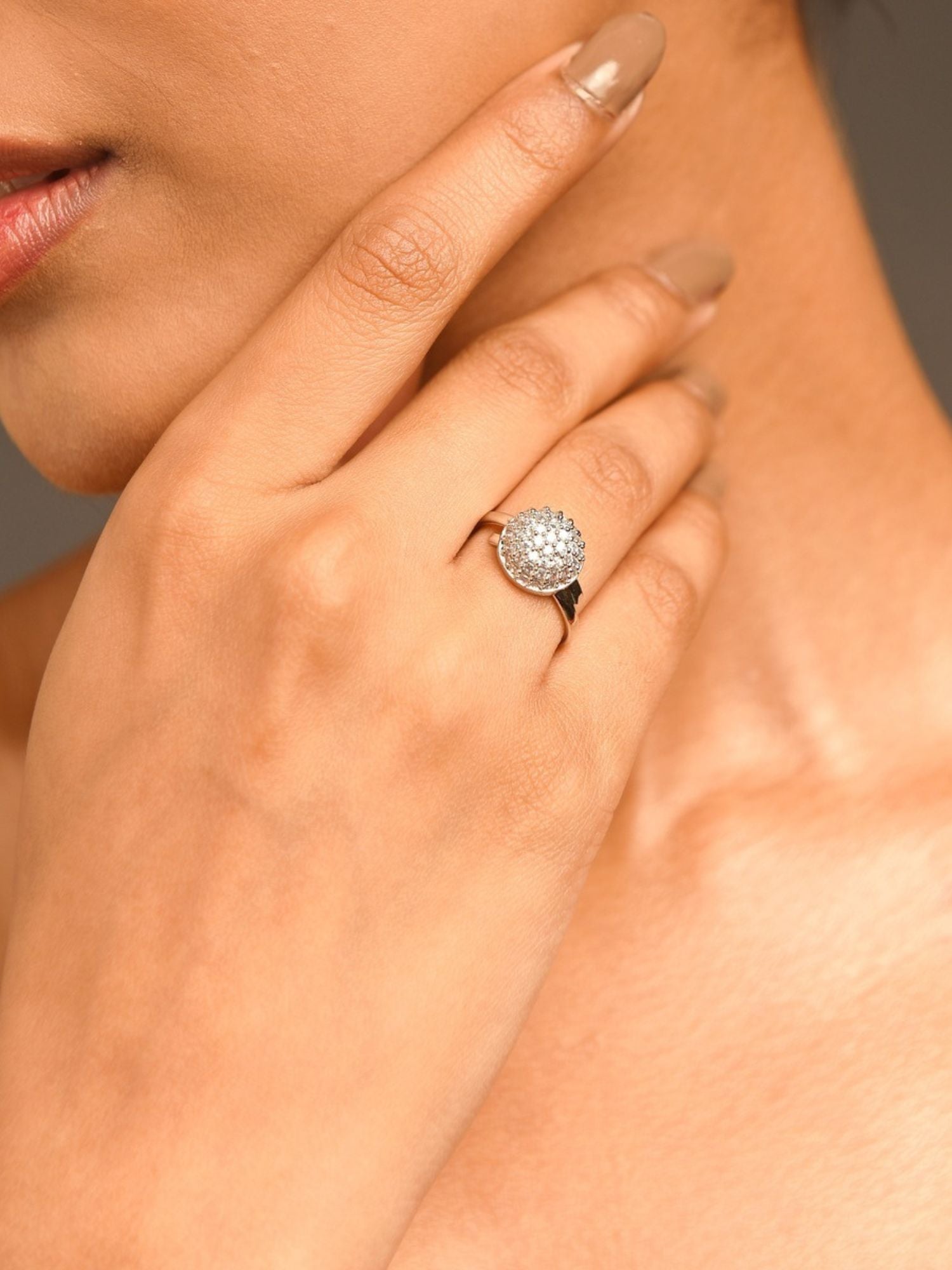 Close up of hand wearing Abdesigns Jewellery Silver Fashion Ring with Stones on ring finger on neutral background