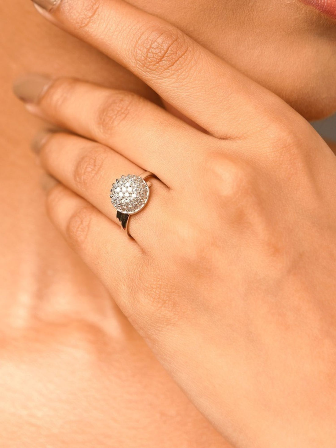 Abdesigns Jewellery Silver Fashion Ring with Stones. Closeup of a model wearing a round pave silver ring on finger