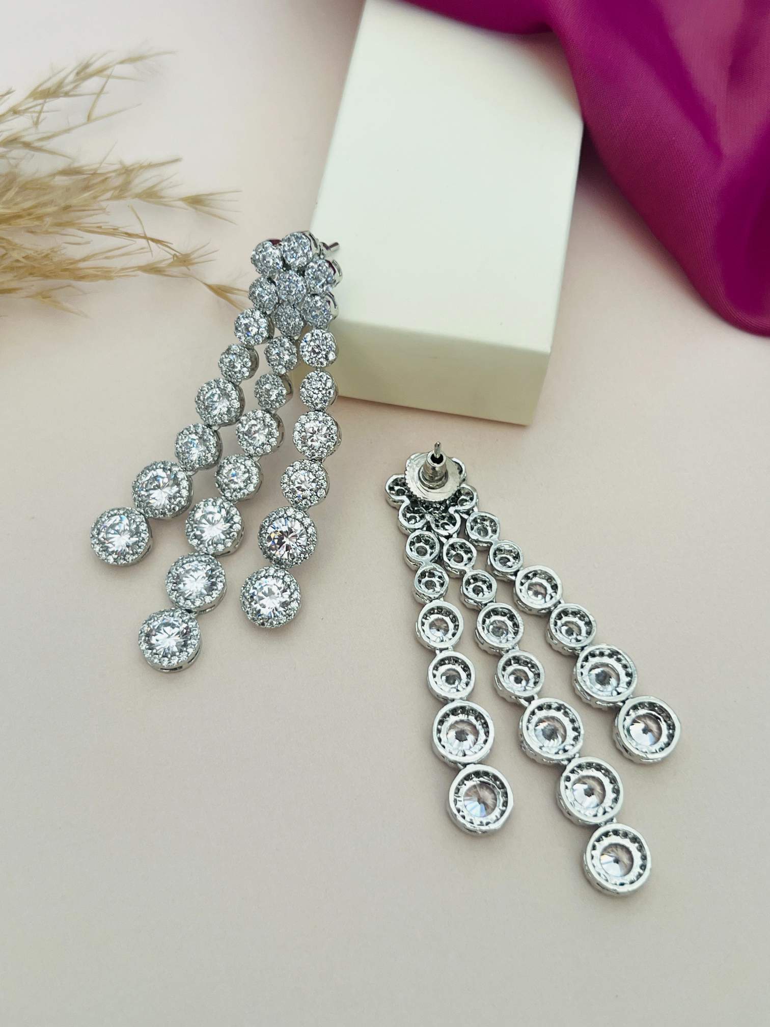 Silver chandelier dangle earrings shown with Silver Plated American Diamond Multilayer Necklace Set By Abdesigns Jewellery.