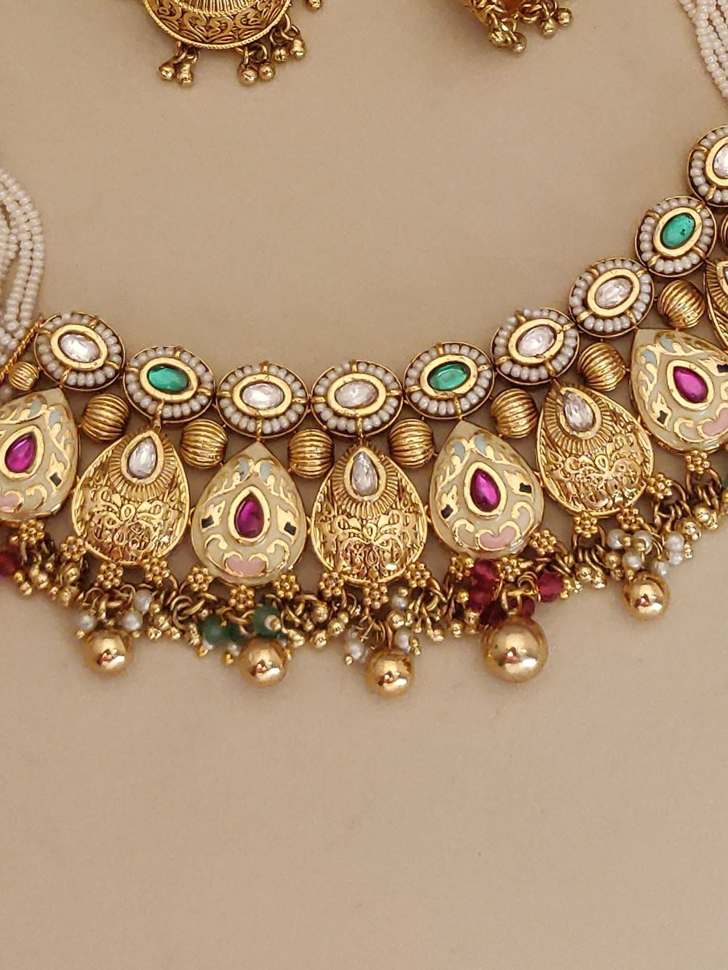 Abdesigns Jewellery Traditional Gold Pearl Necklace Set with intricate gold detailing and colorful stones