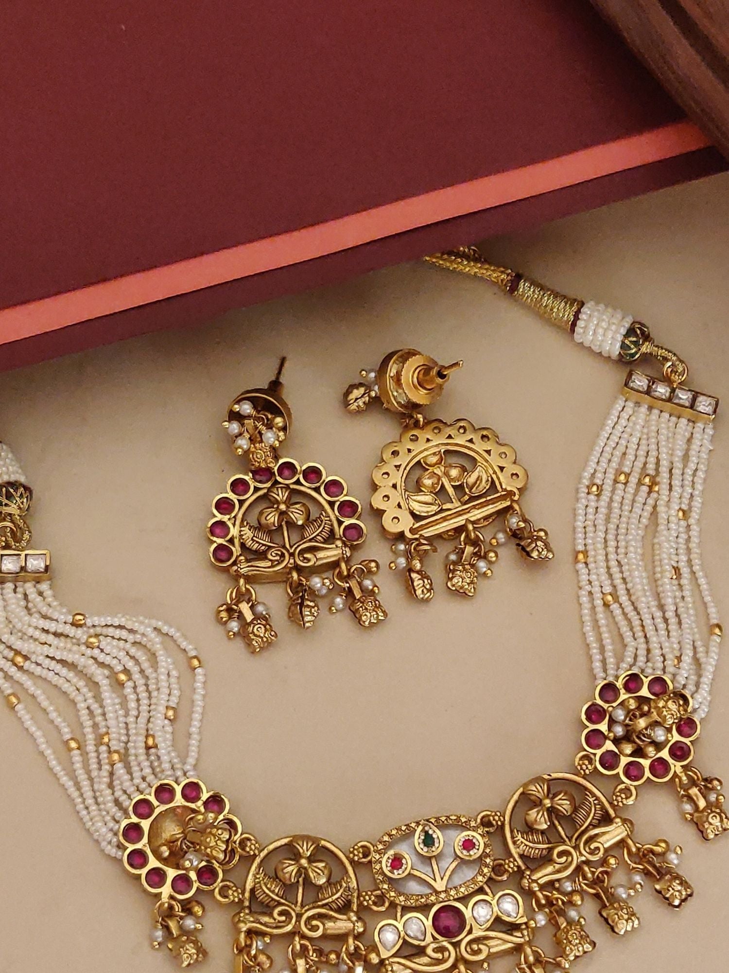 Abdesigns Jewellery Traditional Pearl Gold Necklace Set with intricate gold detailing and red stone accents