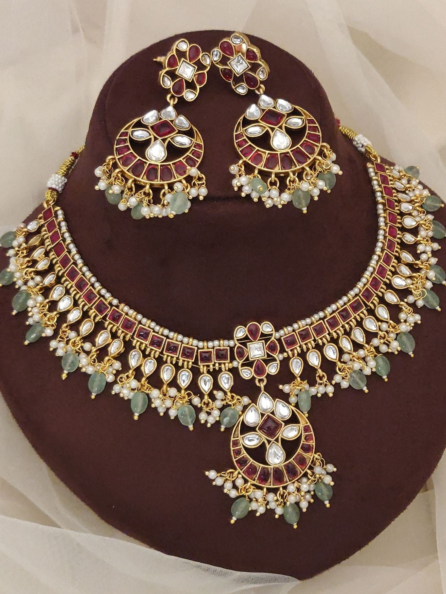 Abdesignsjewellery gold Kundan necklace and earrings with red stones green beads and pearls luxury Indian bridal jewelry set
