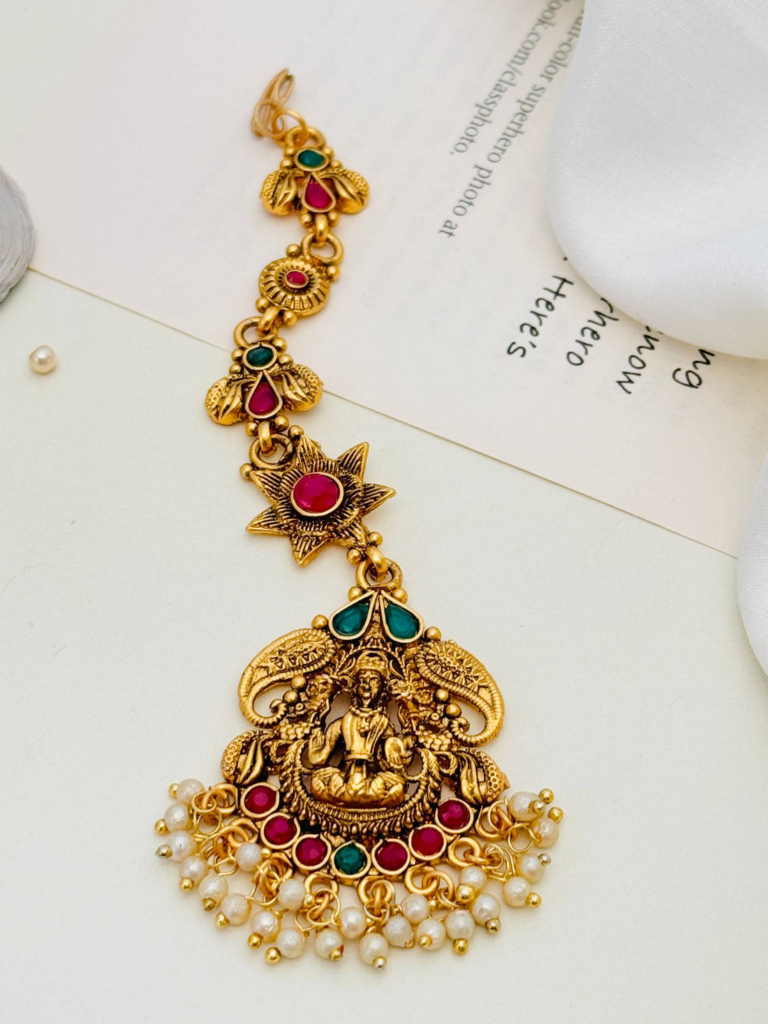 Matt Gold Plated Goddess Laxmi SouthIndian Maangtikka with intricate design and pearl embellishments