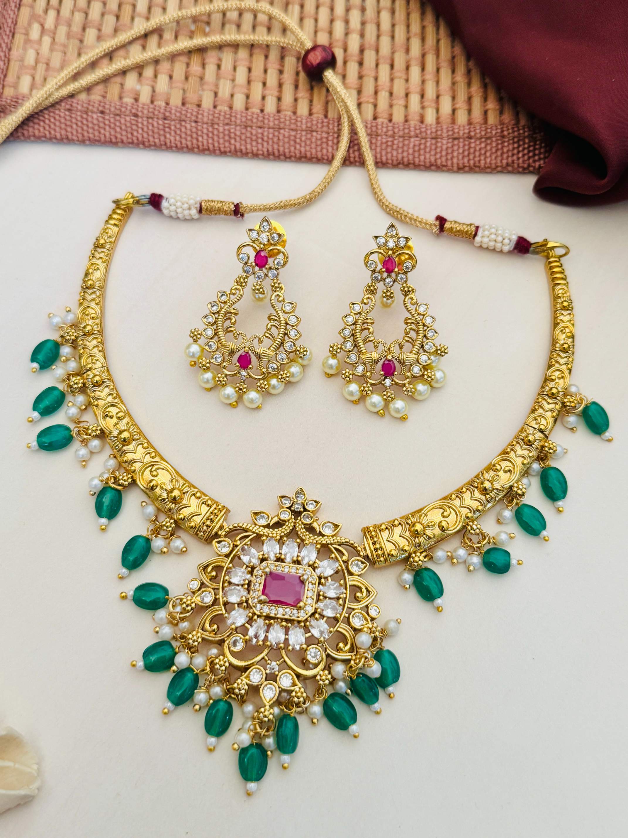 Matt Gold Plated Temple Necklace Set with green beads and matching intricate earrings by Abdesignsjewellery