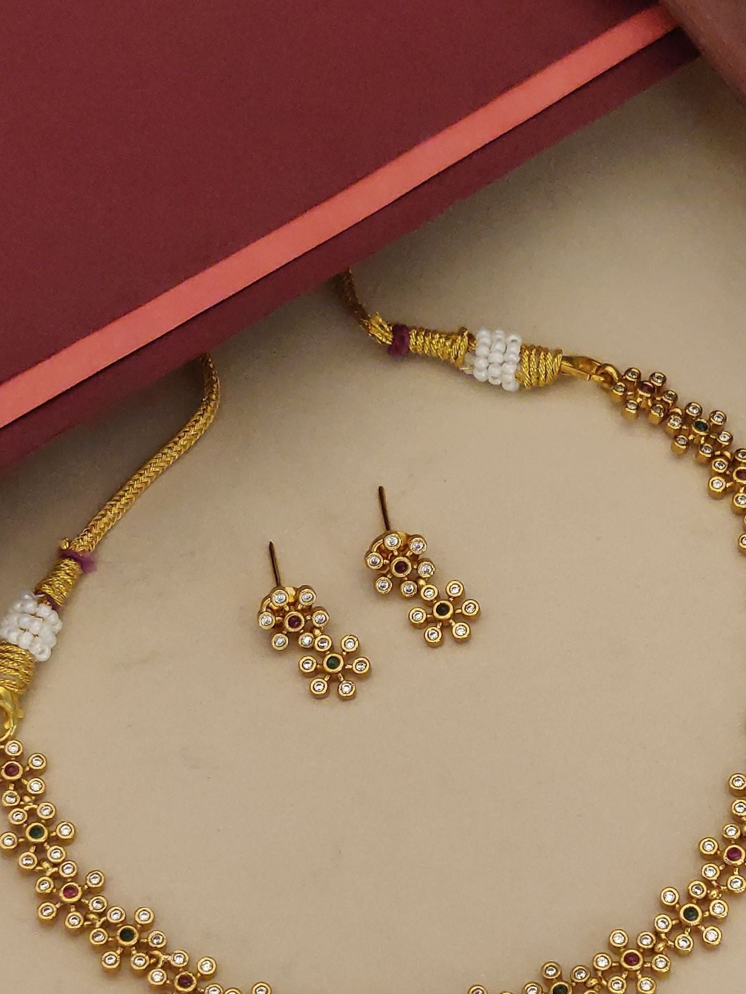 Abdesignsjewellery minimal Floral gold plated necklace set featuring delicate floral motifs and matching earrings