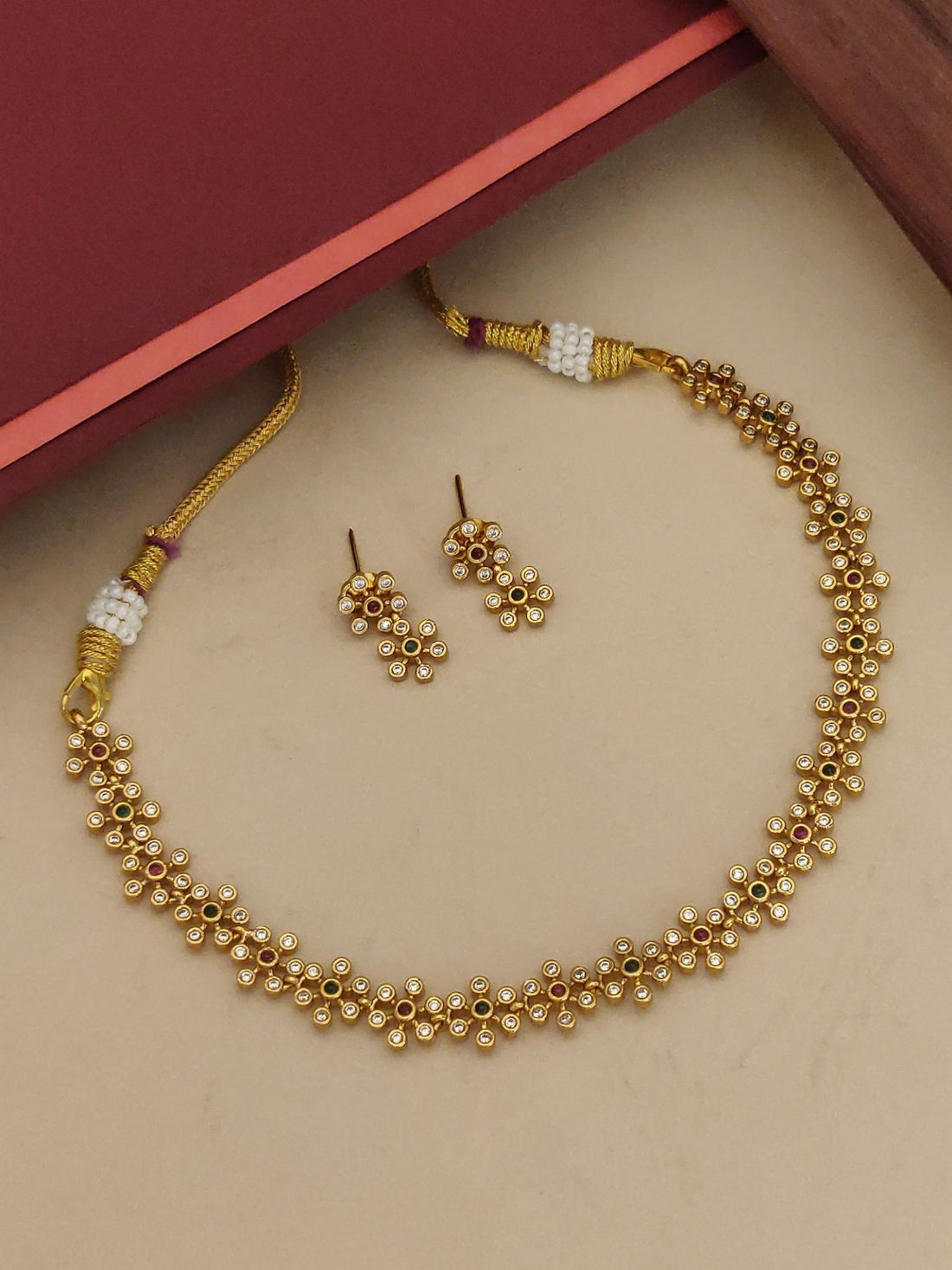 Abdesignsjewellery minimal Floral gold plated necklace set with delicate flower motifs and matching stud earrings