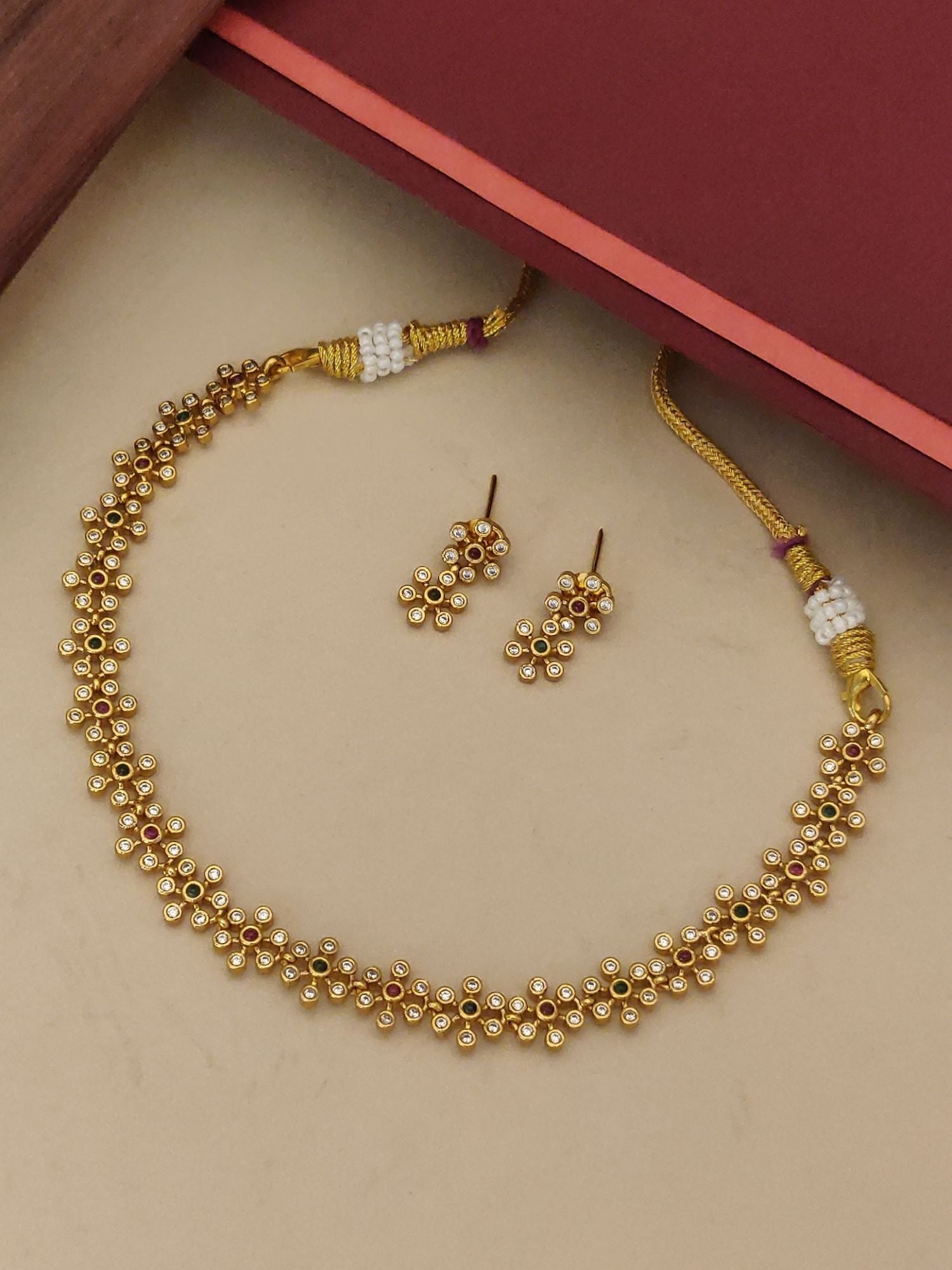 Abdesignsjewellery minimal Floral gold plated necklace set with delicate floral motifs and matching stud earrings