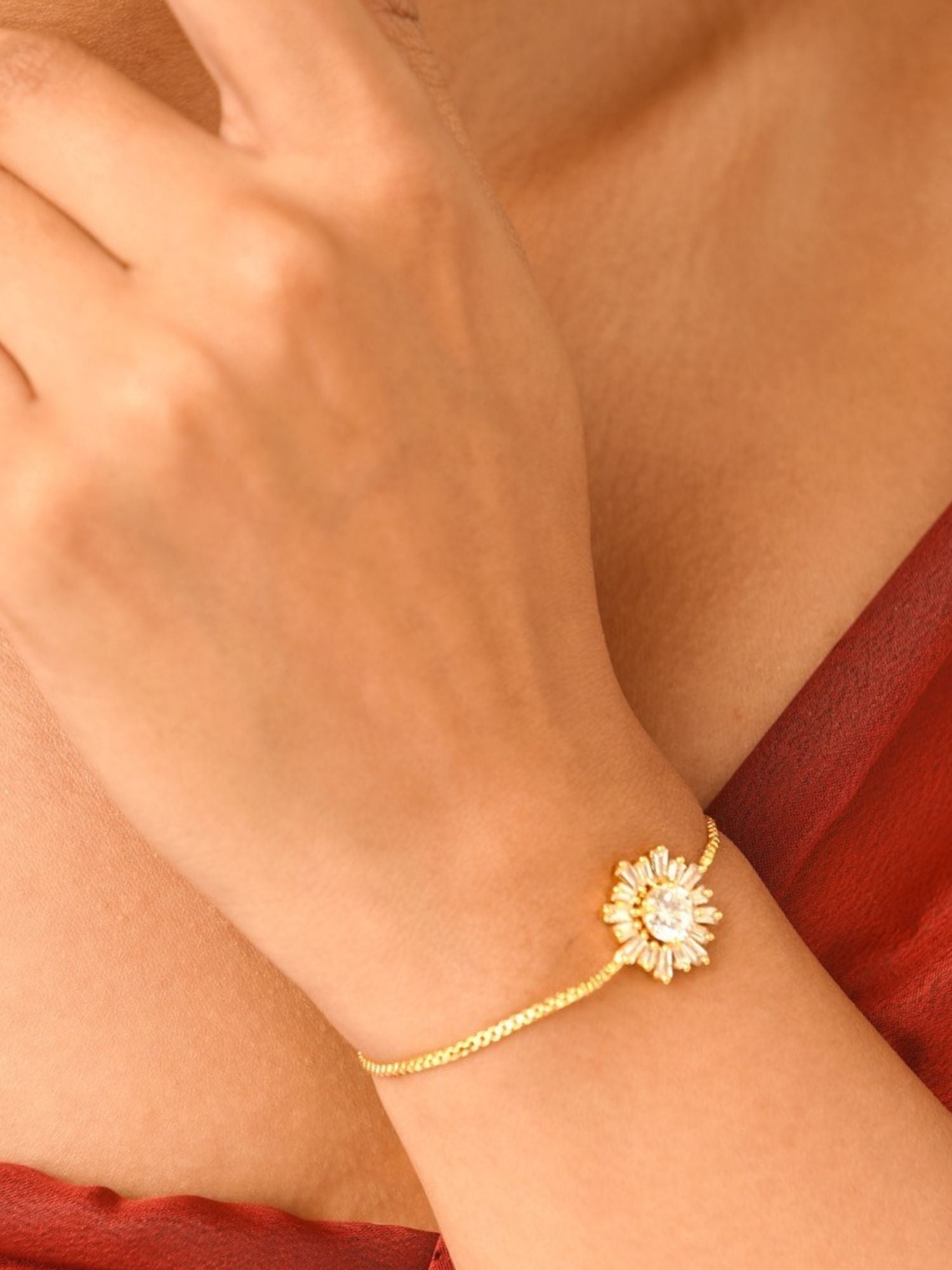 Abdesignsjewellery minimal gold plated bracelet with daisy crystal charm on model wrist