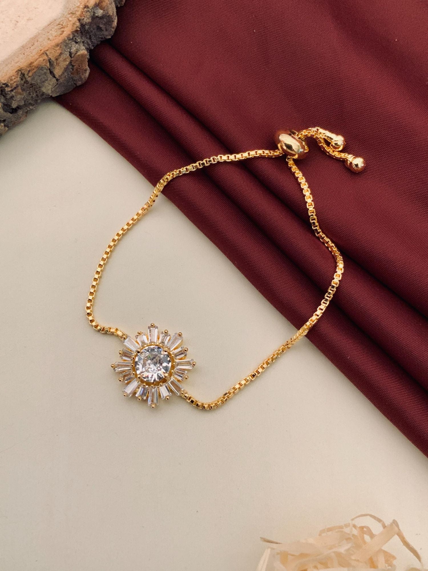 Abdesignsjewellery minimal gold plated bracelet with sunburst crystal pendant and adjustable slider chain