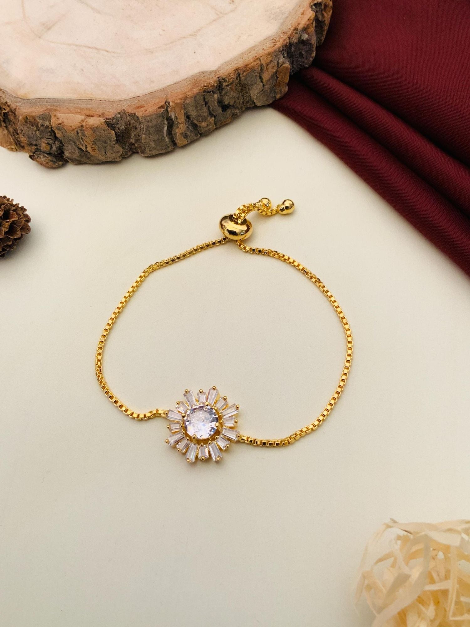 Abdesignsjewellery minimal gold plated bracelet with sunburst crystal center and adjustable slider chain