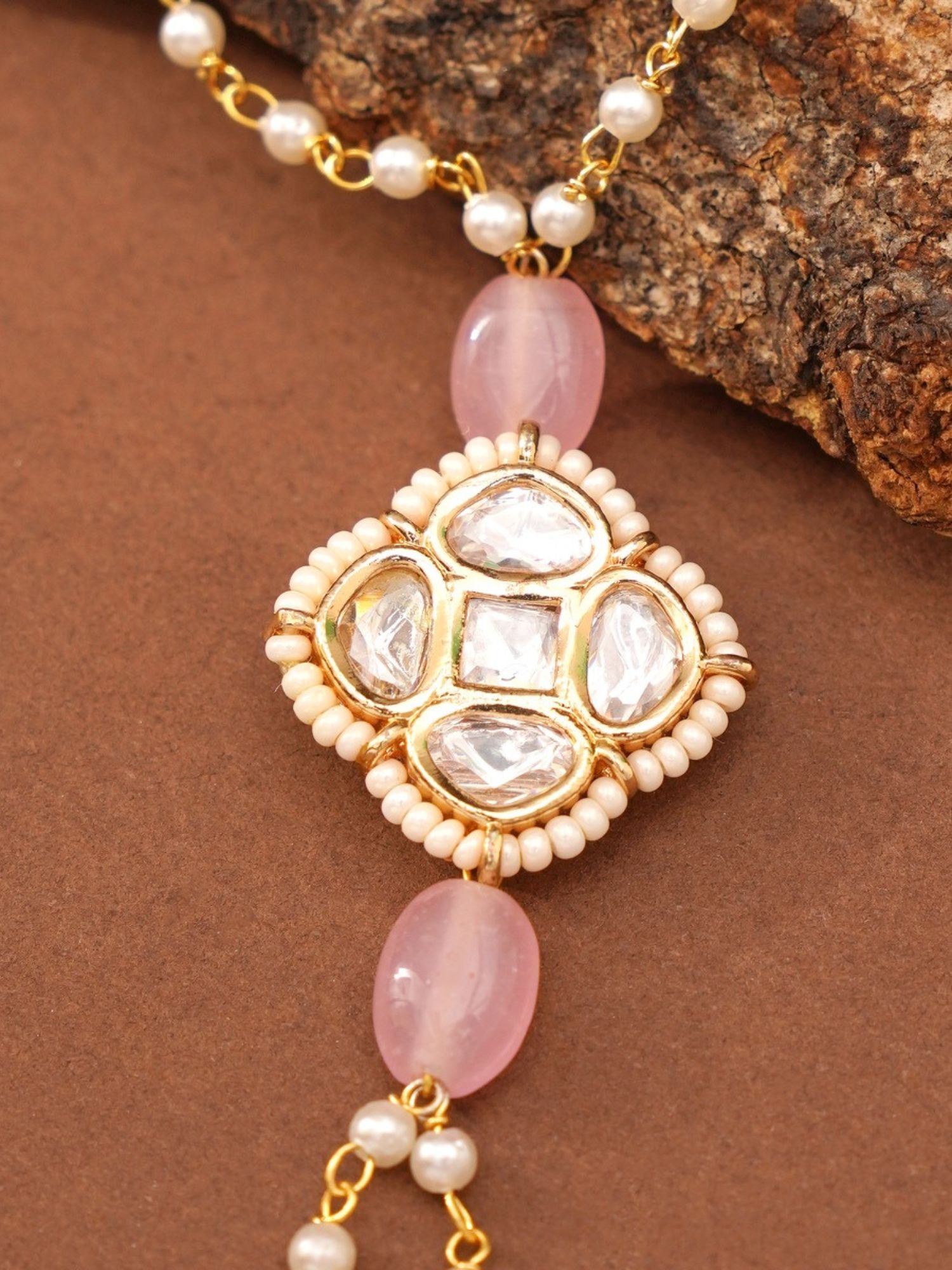 minimal gold plated hand pocha bracelet with pink bead accents pearl chain and kundan white stone pendant