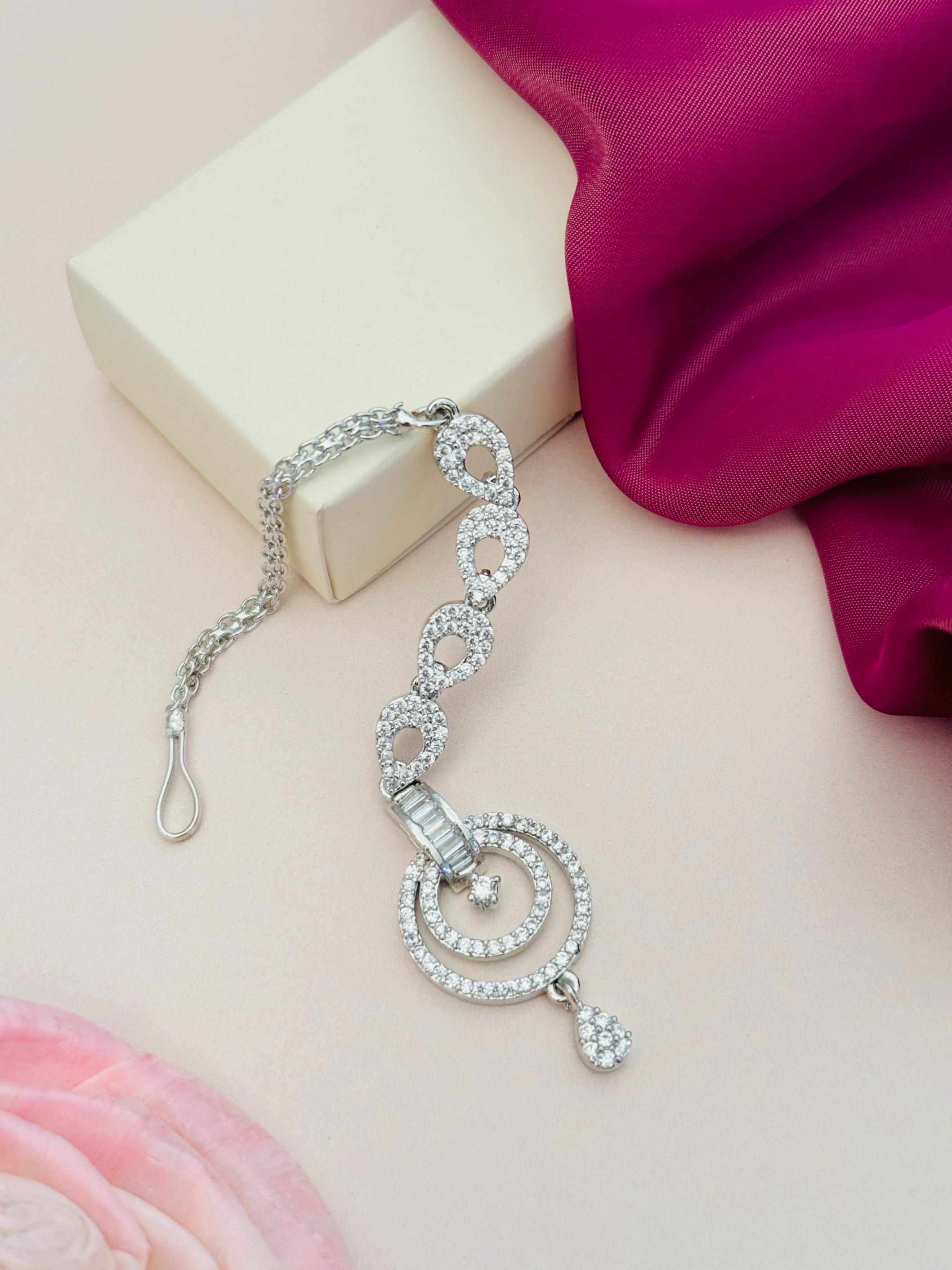 Minimalist Silver Plated American Diamond Maangtikka with intricate circular design by Abdesignsjewellery