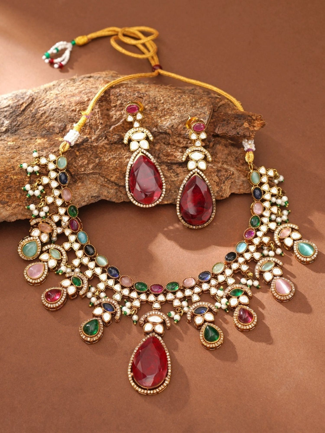 Abdesignsjewellery multicolor polki necklace set for women on model with red teardrop pendant and matching earrings