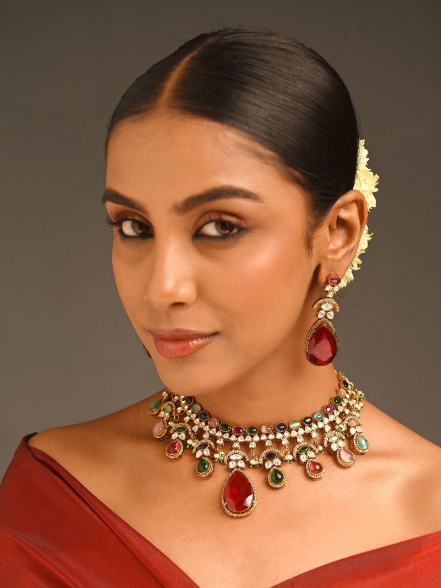 Abdesignsjewellery multicolor polki necklace set for women on model with red teardrop pendant and matching earrings