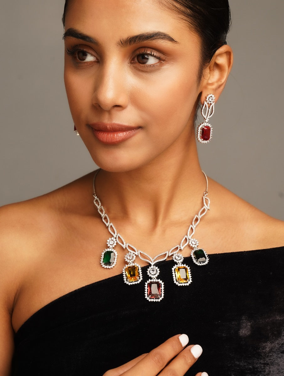 Multicolour Crystal American Diamond Necklace Set with colorful stones worn by woman in black dress