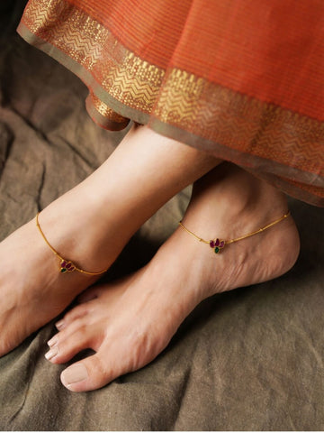 Multicolour Lotus Kemp Stone Anklets on feet with gold chain and floral design by Abdesignsjewellery