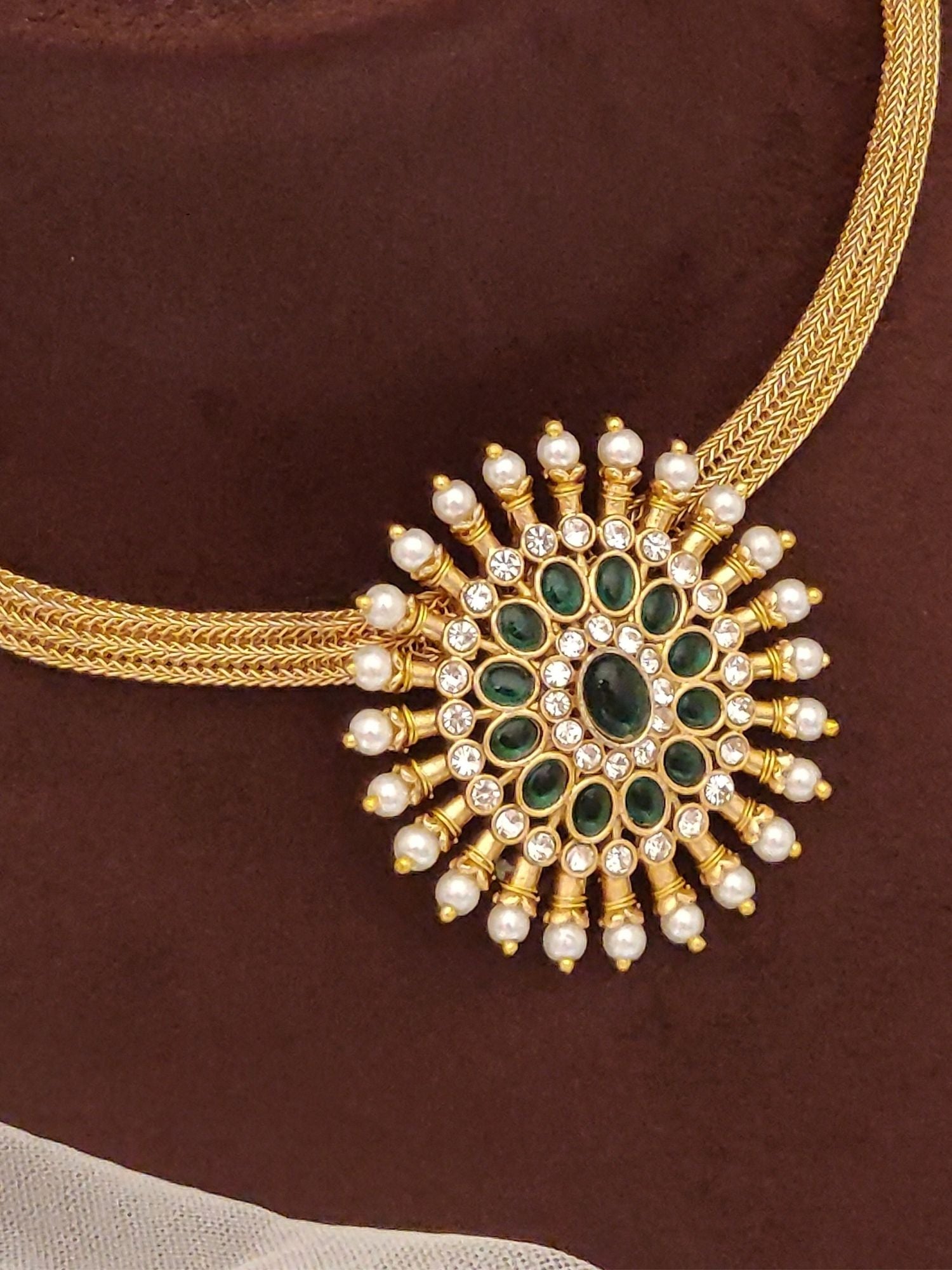 Abdesignsjewellery gold pendant chain with circular floral medallion featuring pearl and green stone pendant set