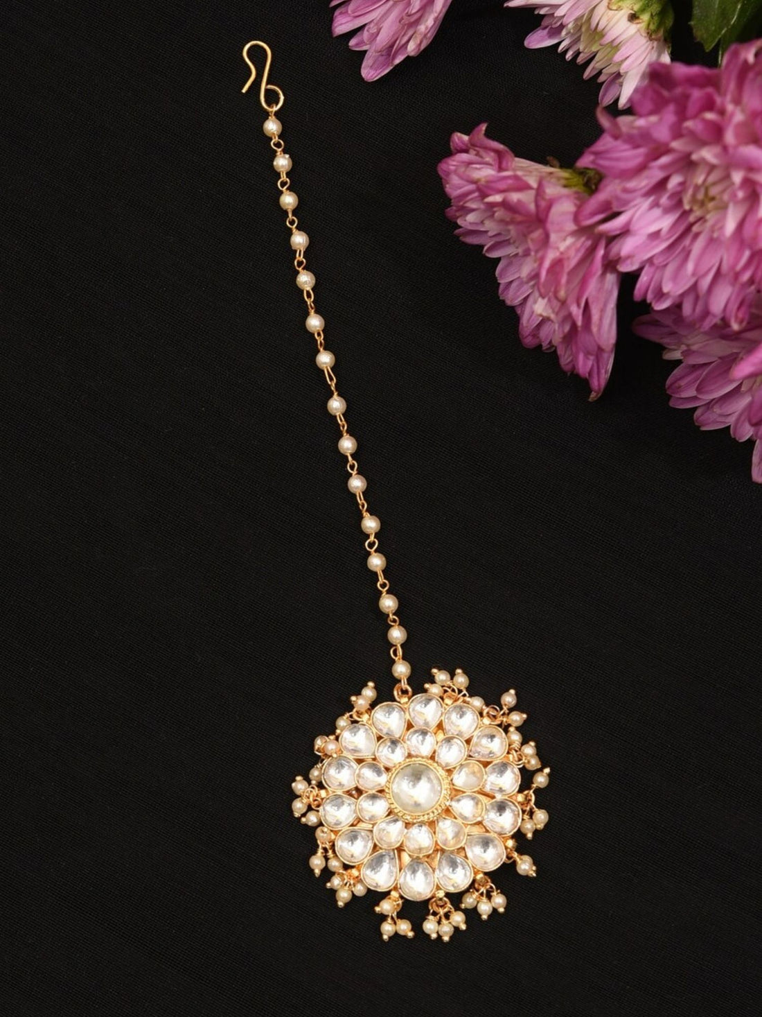 Close-up of Polki Kundan Maangtikka worn on forehead showcasing intricate gold and white stone design by Abdesignsjewellery
