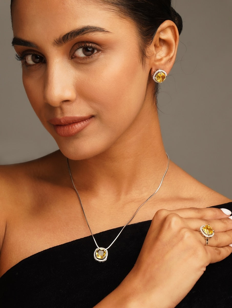 Precious Silver Plated Cz Pendant Chain Combo necklace worn by woman with matching yellow stone earrings and ring