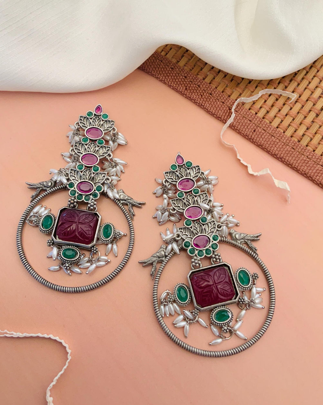 Abdesignsjewellery premium long German silver earrings with intricate green and red gemstone details on woman