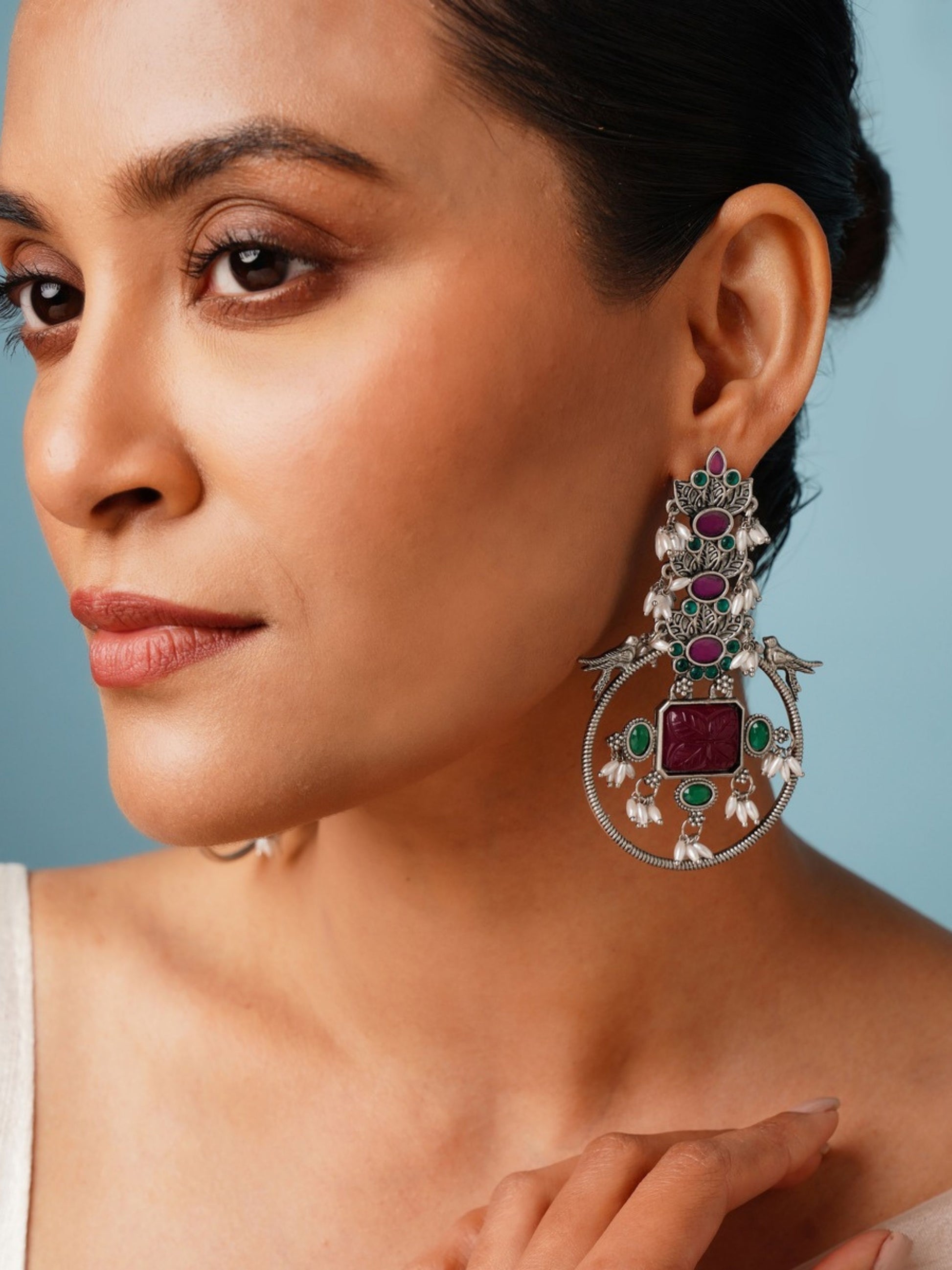 Abdesignsjewellery premium long German silver earrings with intricate green and red gemstone details on woman