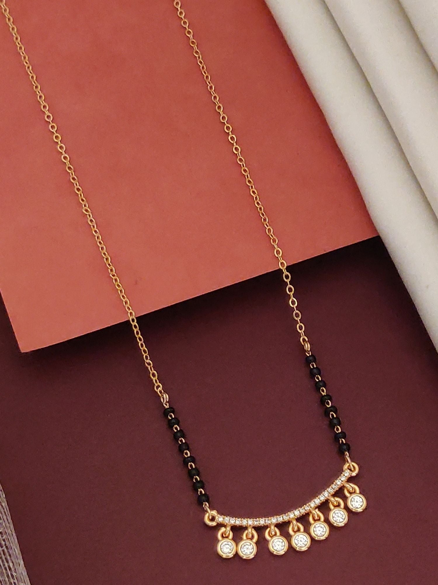 Rose Gold Plated American Diamond Mangalsutra with black beads and dangling round diamond charms on delicate chain