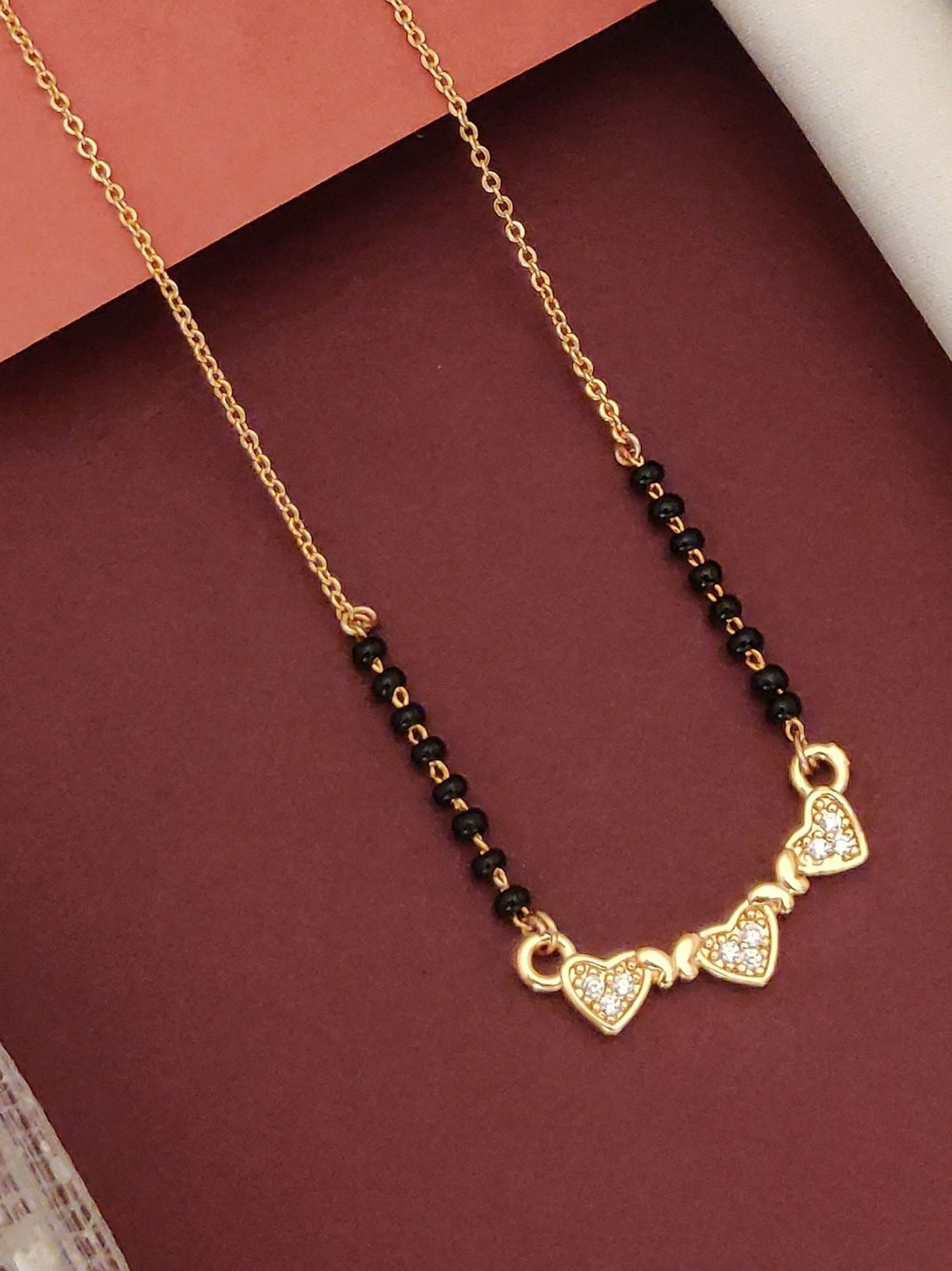 Abdesigns Rose Gold Plated Black Beads Mangalsutra with Heart-Shaped Pendant and Elegant Design