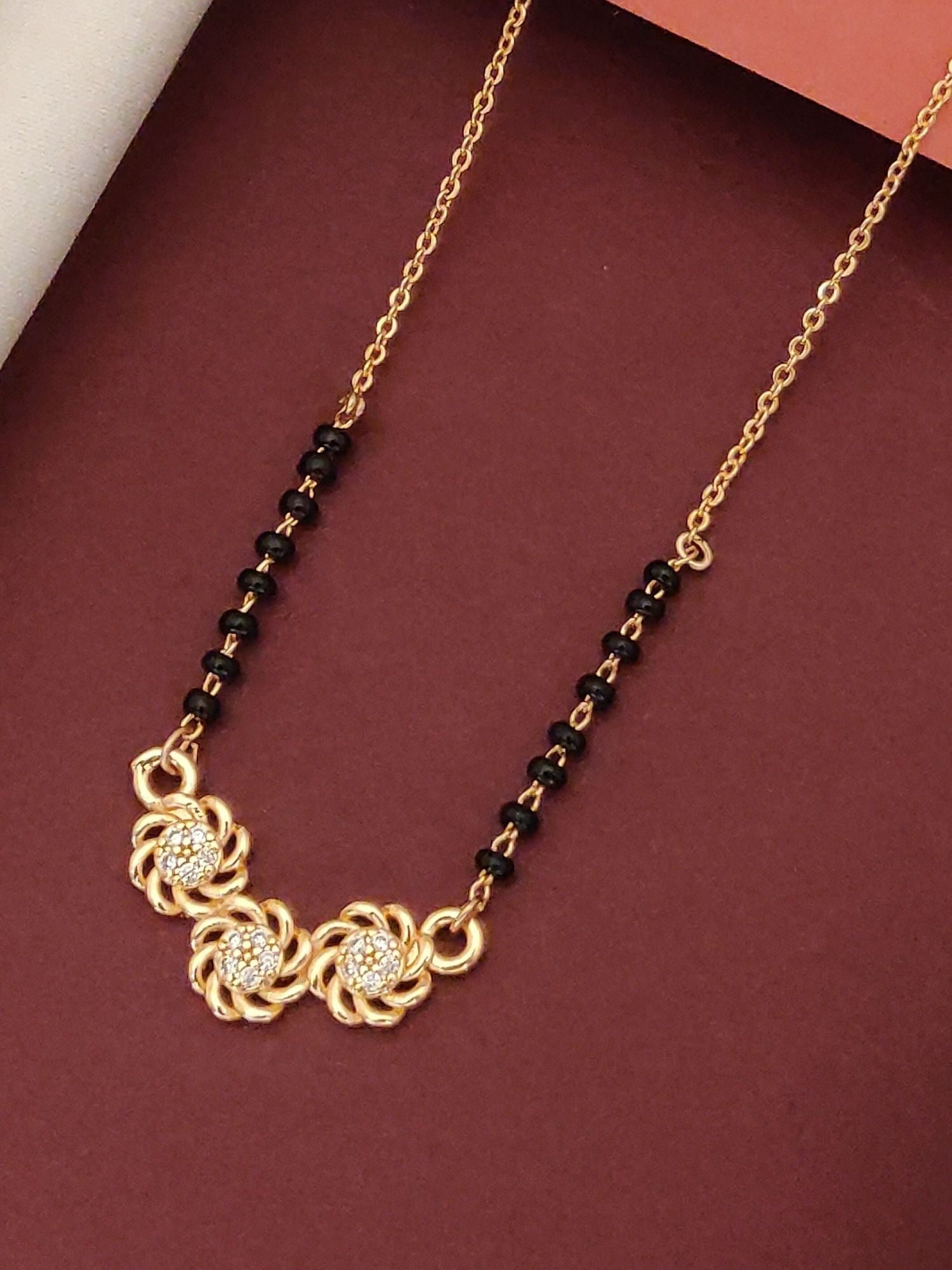 Elegant Rose Gold Plated Black Beads Mangalsutra with floral accents and black bead detailing