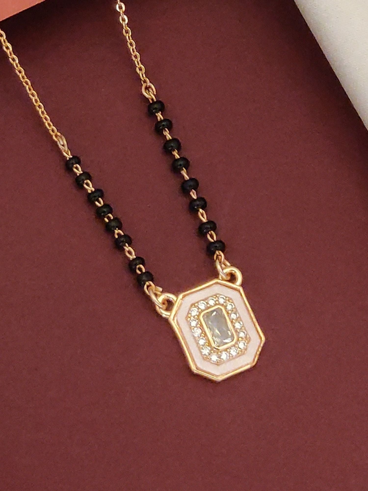 Abdesigns Rose Gold Plated Black Beads Mangalsutra with elegant octagon pendant and sparkling stones