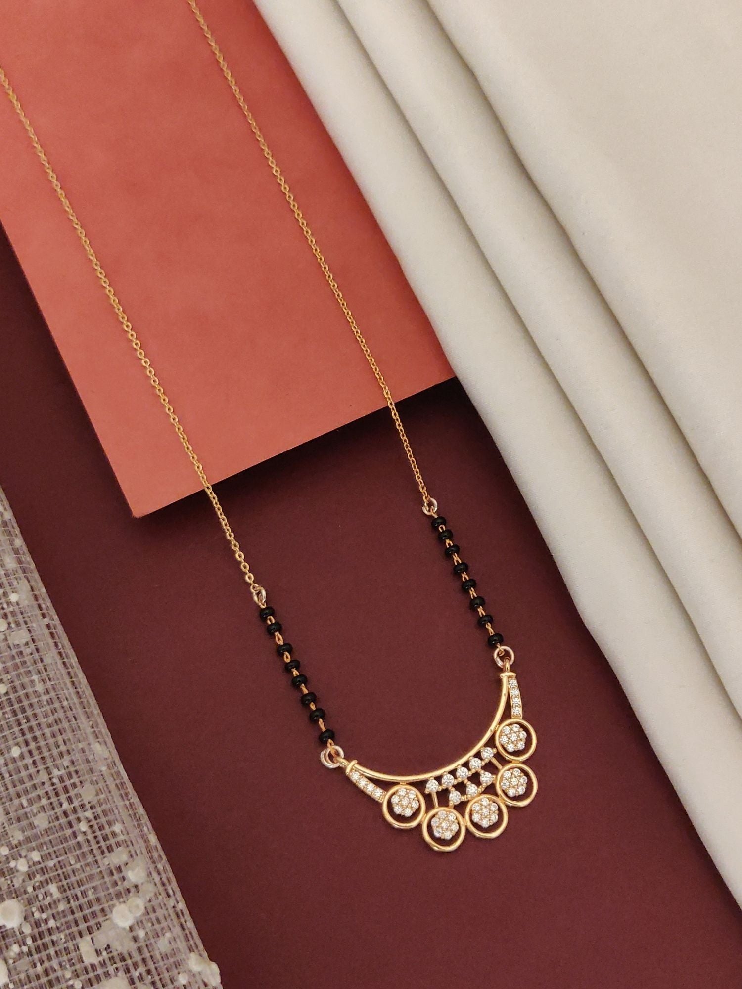 Abdesigns Rose Gold Plated Black Beads Mangalsutra with elegant design and sparkling stones