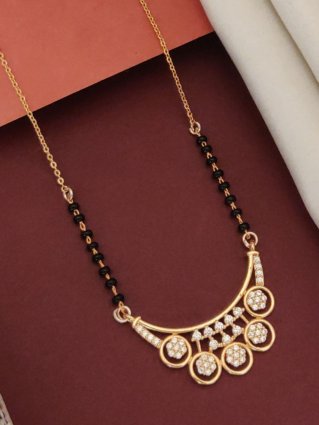 Abdesigns Rose Gold Plated Black Beads Mangalsutra with elegant design and sparkling stones