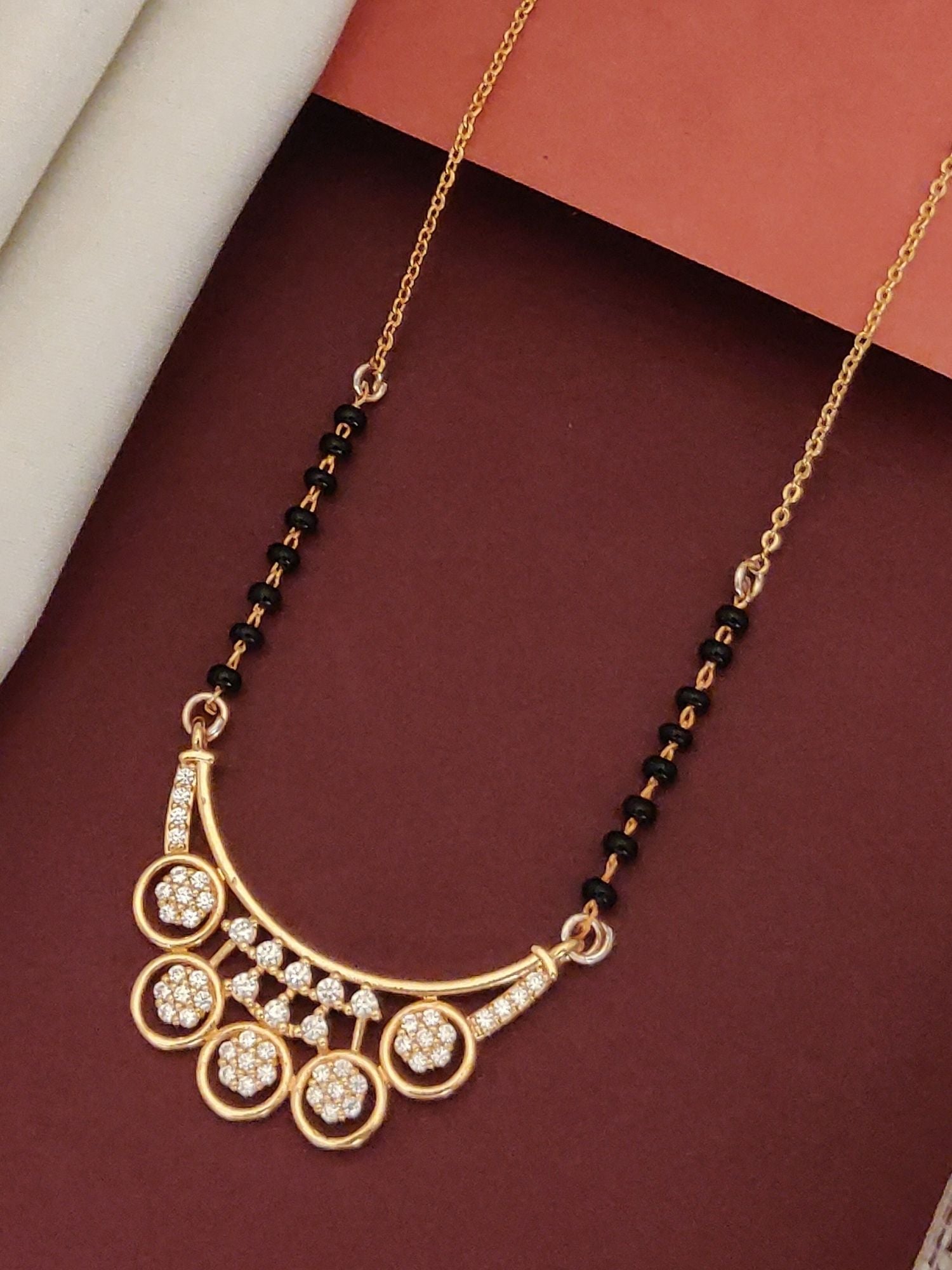 Abdesigns Rose Gold Plated Black Beads Mangalsutra with elegant design and sparkling embellishments