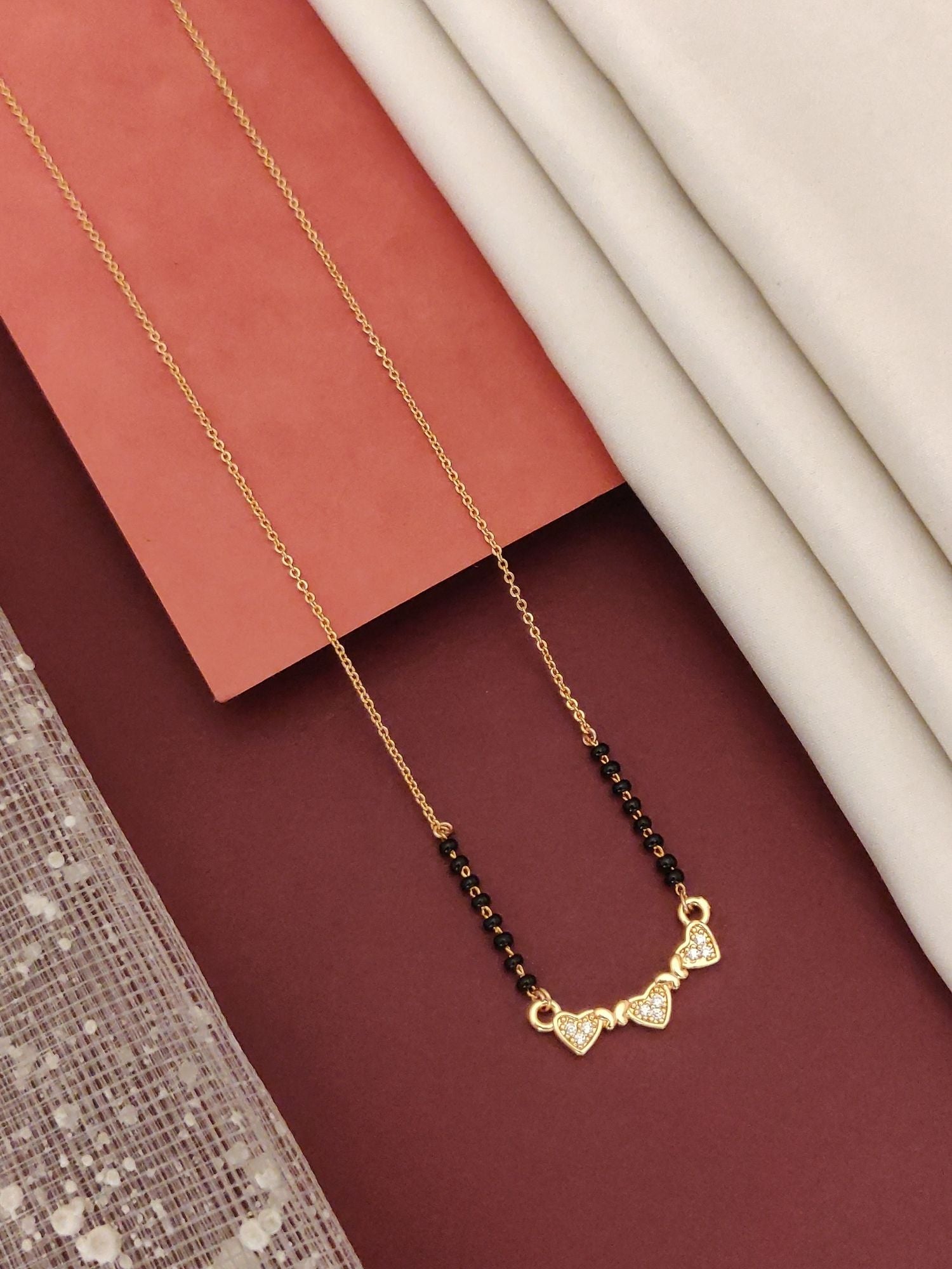 Abdesigns Rose Gold Plated Black Beads Mangalsutra with Heart-Shaped Pendant and Elegant Design