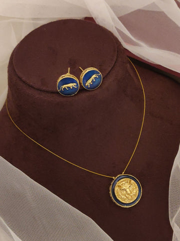 Sabyasachi inspired necklace earrings set gold chain with blue enamel coin pendant and matching stud earrings on brown bust