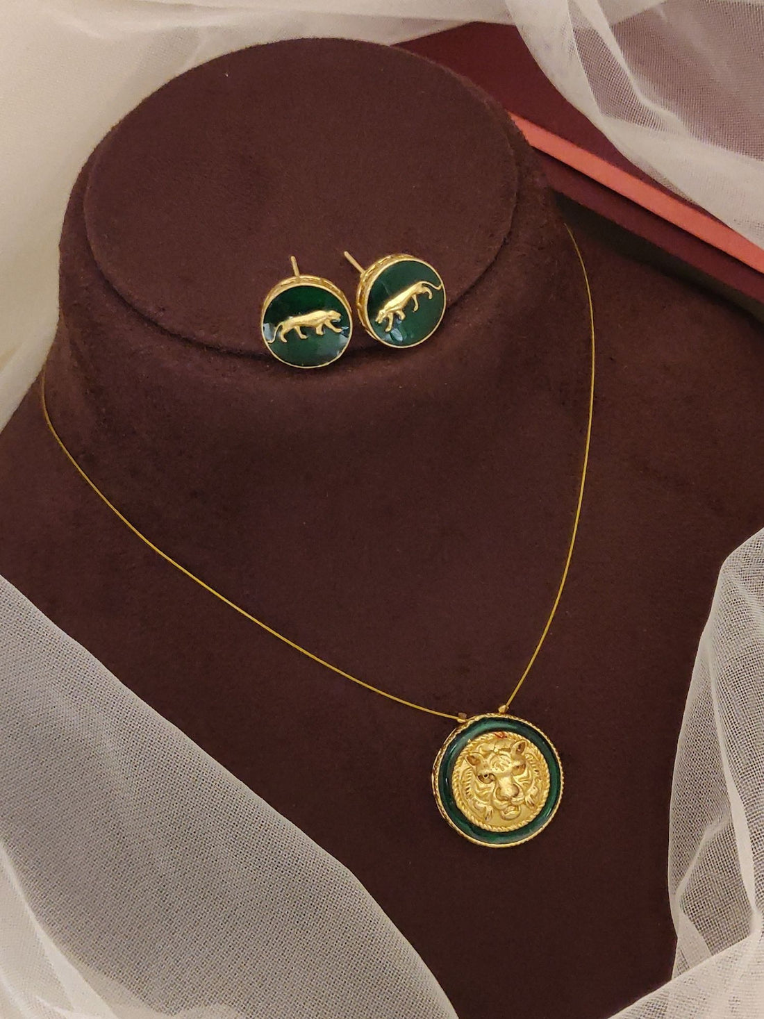 Sabyasachi inspired necklace earrings set gold chain with blue enamel coin pendant and matching stud earrings on brown bust