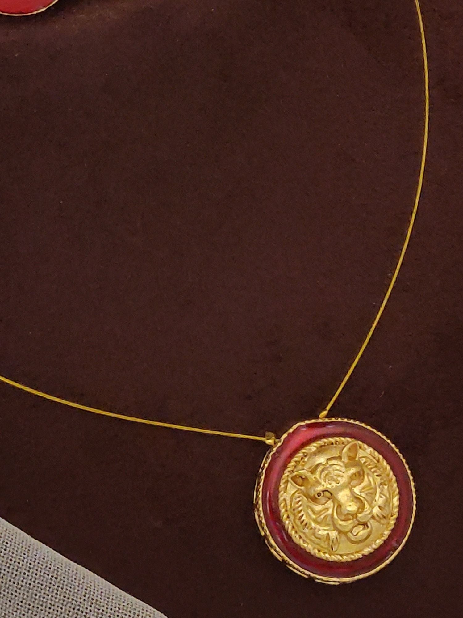 Abdesignsjewellery gold pendant chain with red enamel round lion motif Sabyasachi inspired necklace earrings set