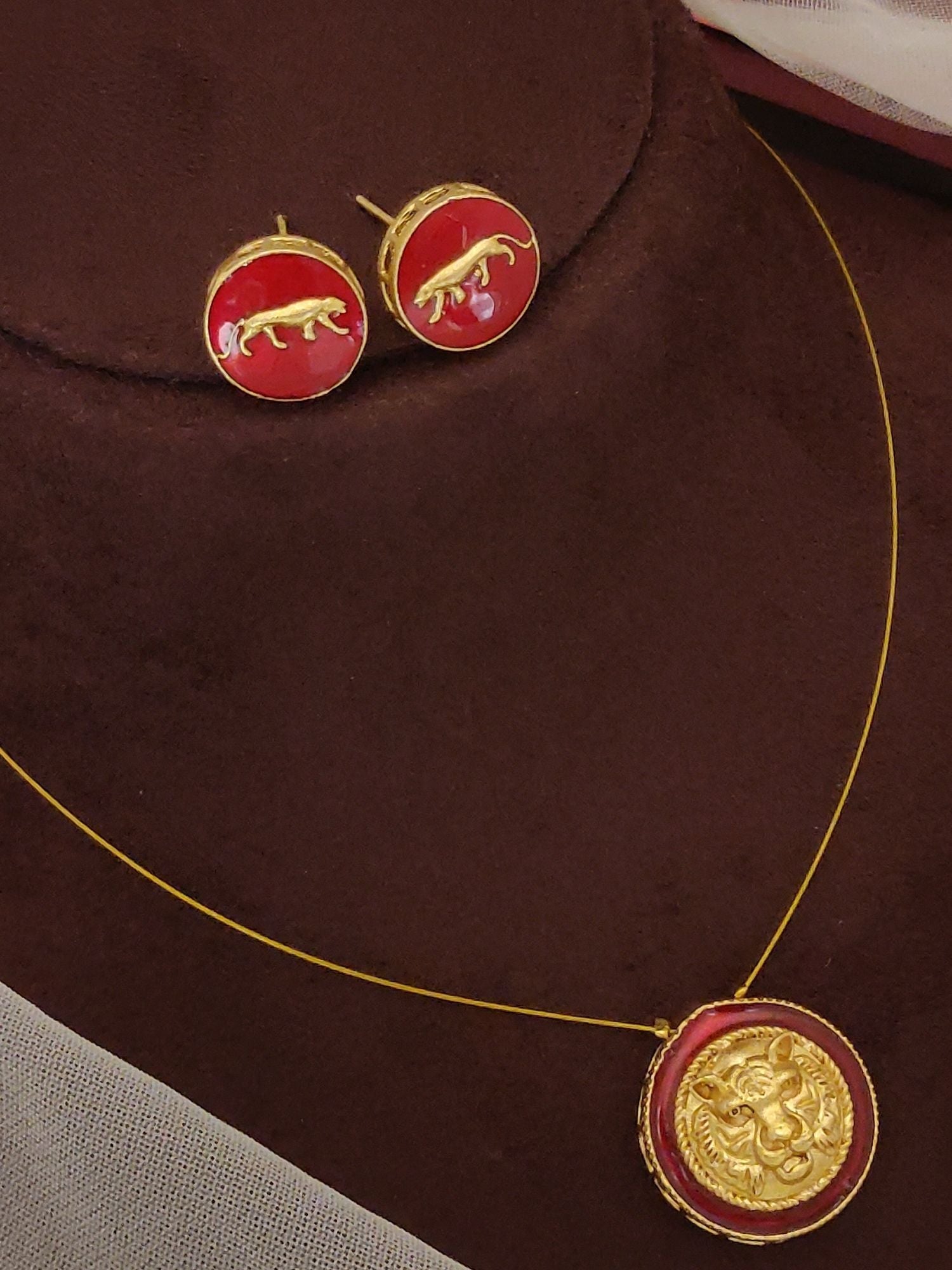 Abdesignsjewellery pendents chain featuring Sabyasachi inspired necklace earrings set with red enamel rounds and gold motifs
