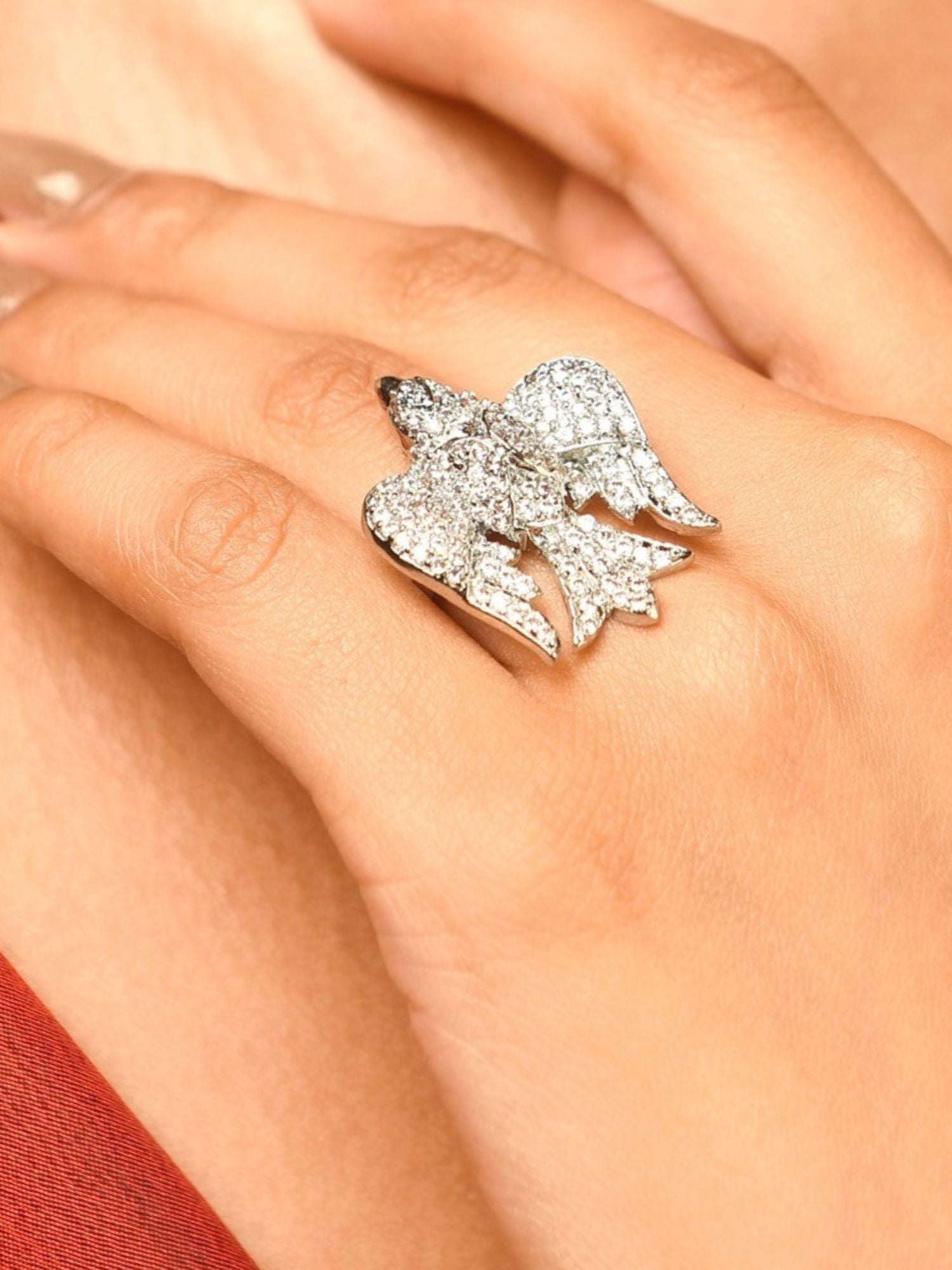 Close up of silver plated American diamond bird ring on hand sparkling pave bird design by Abdesignsjewellery