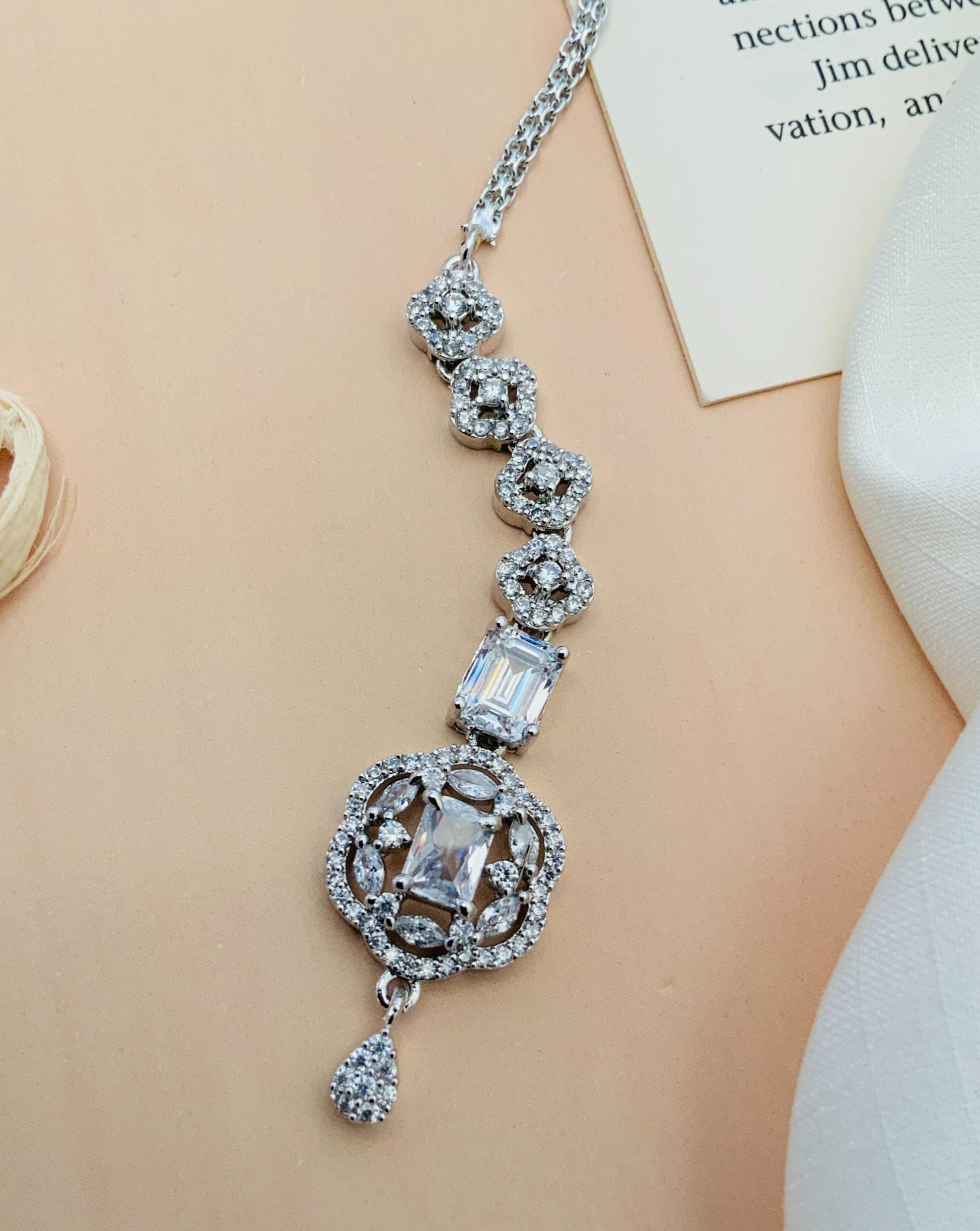Silver Plated American Diamond Maangtikka featuring intricate design with sparkling clear stones and elegant chain by Abdesignsjewellery