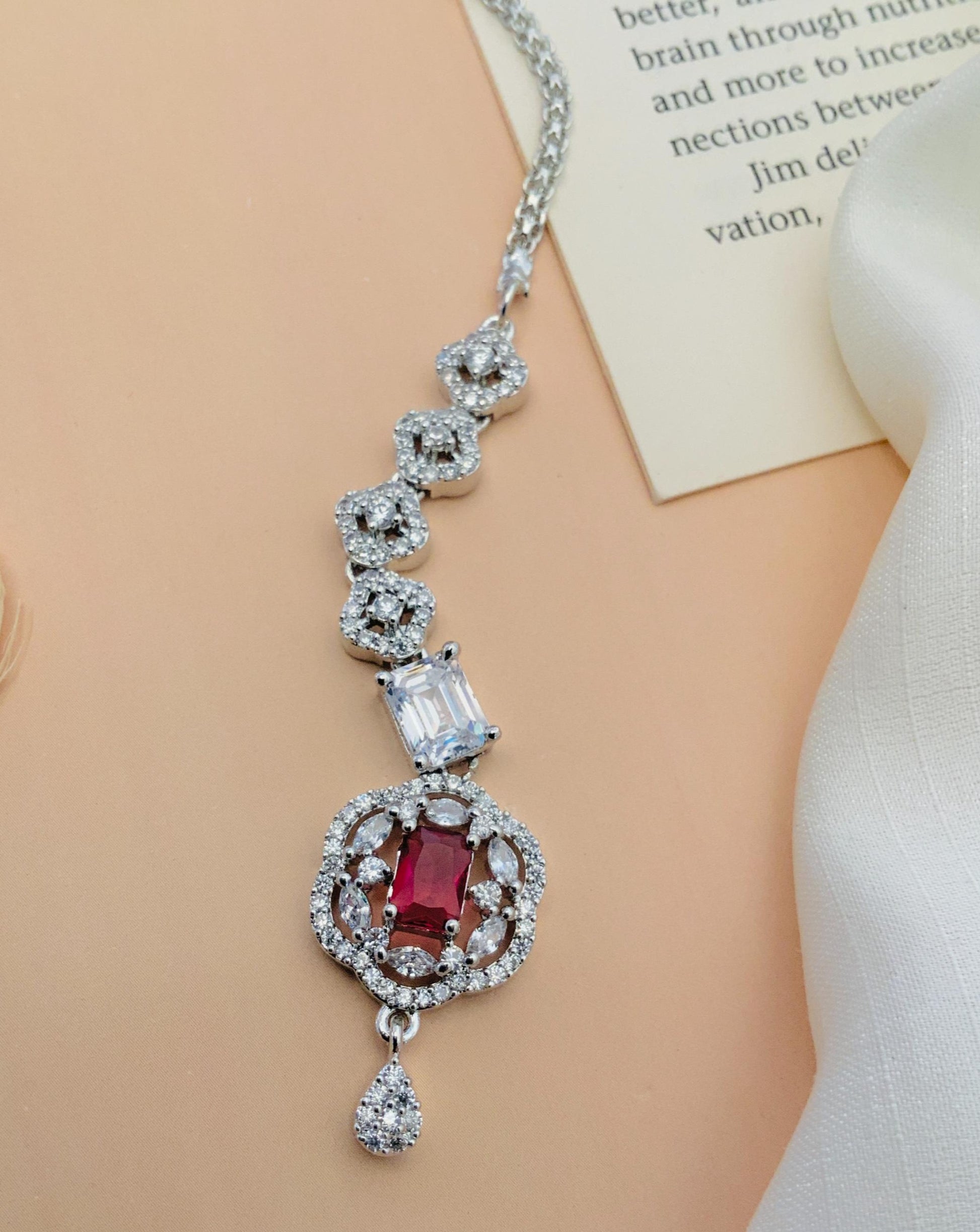 Silver Plated American Diamond Maangtikka with red and clear stones on a silver chain by Abdesignsjewellery