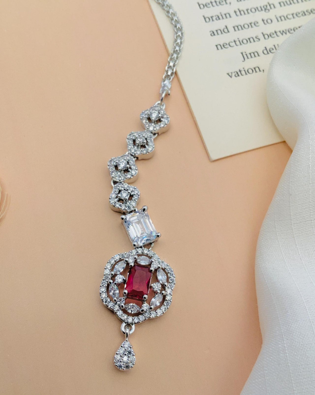 Silver Plated American Diamond Maangtikka with red and clear stones on a silver chain by Abdesignsjewellery