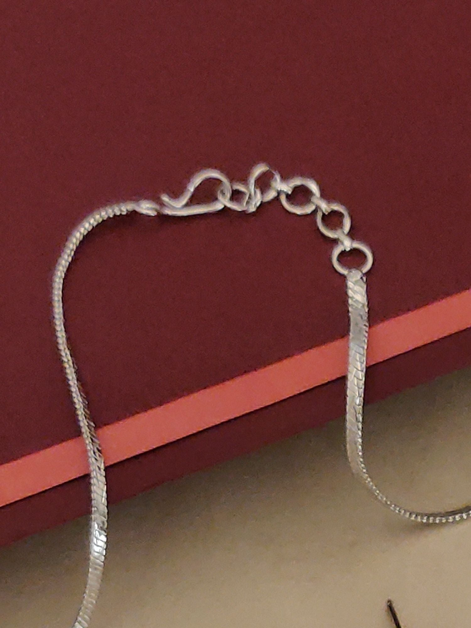 Close-up of silver plated American diamond necklace set chain and clasp by Abdesignsjewellery