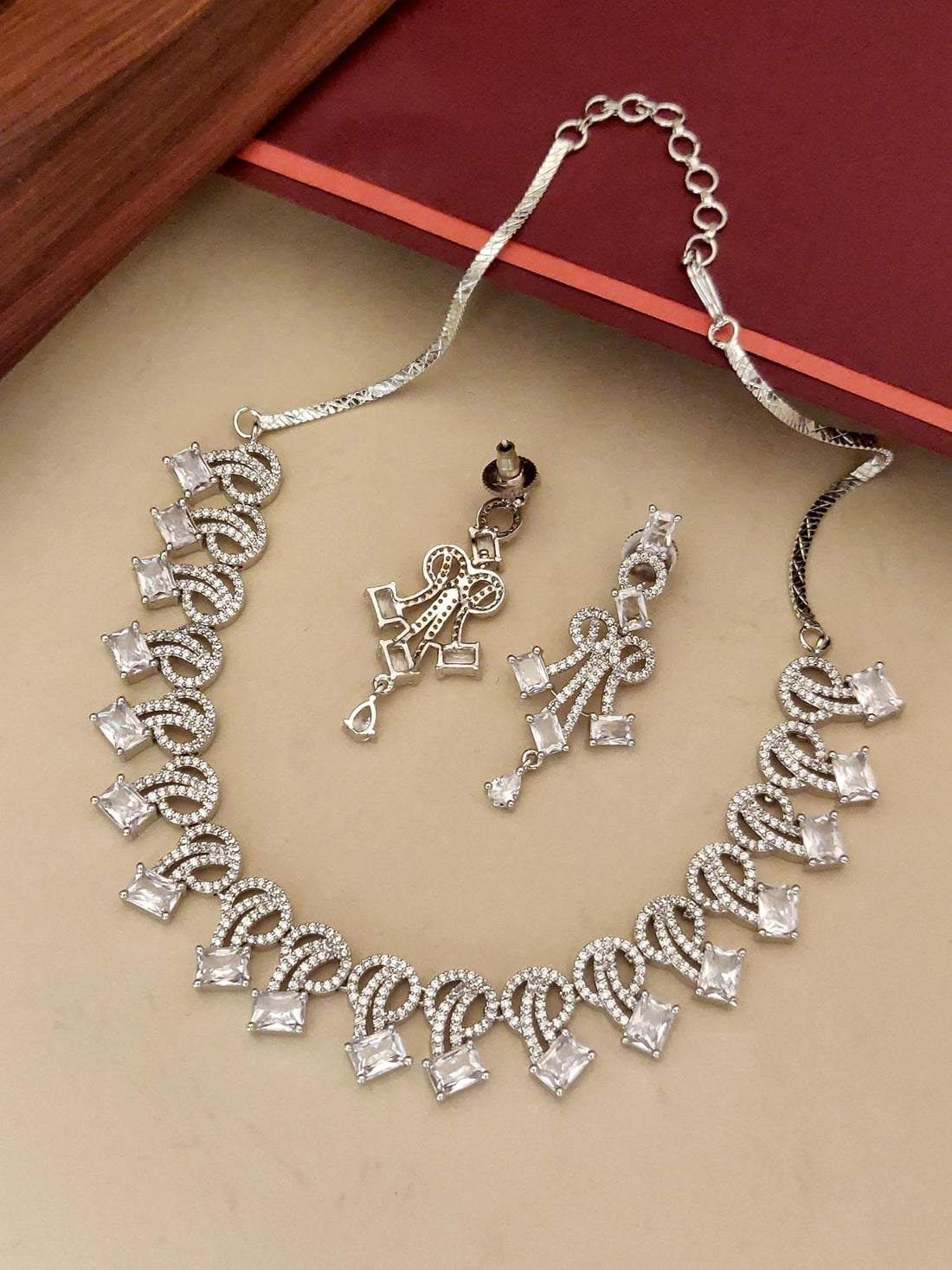 silver plated american diamond necklace set with matching dangling earrings in square stone loop design