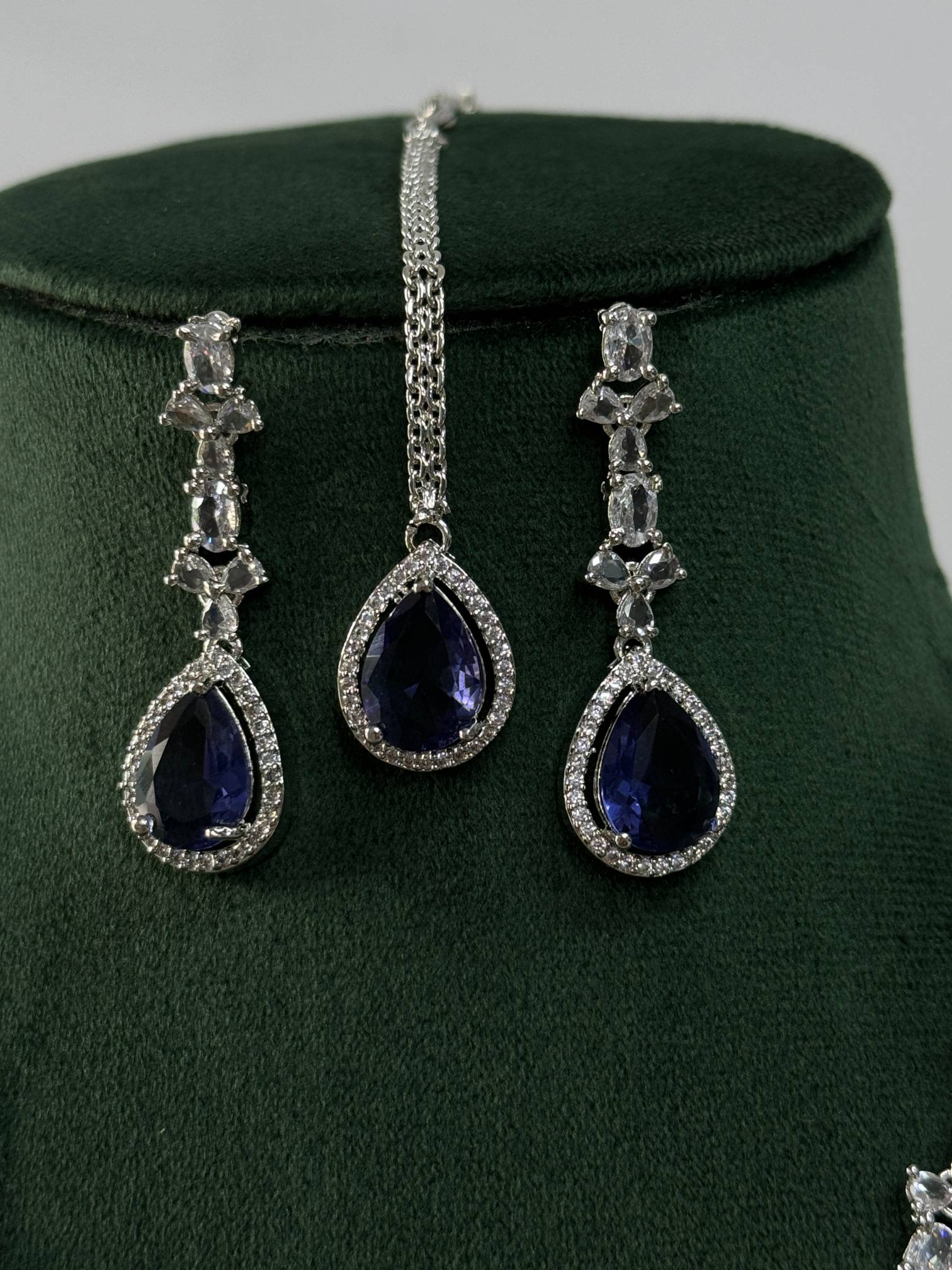 Silver Plated American Diamond Necklace Set with teardrop blue stones and intricate clear diamond detailing