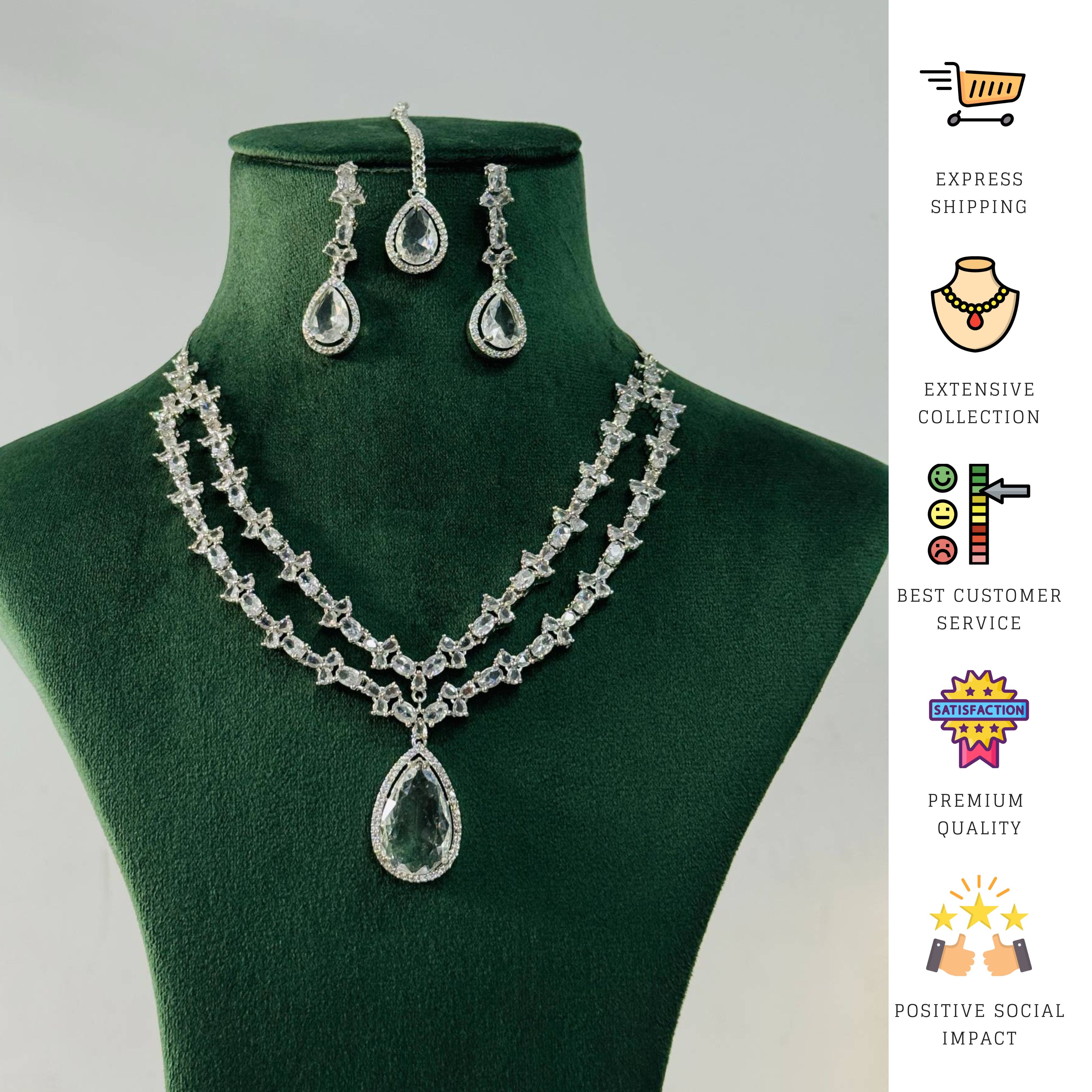 Silver Plated American Diamond Necklace Set with matching earrings displayed on green stand