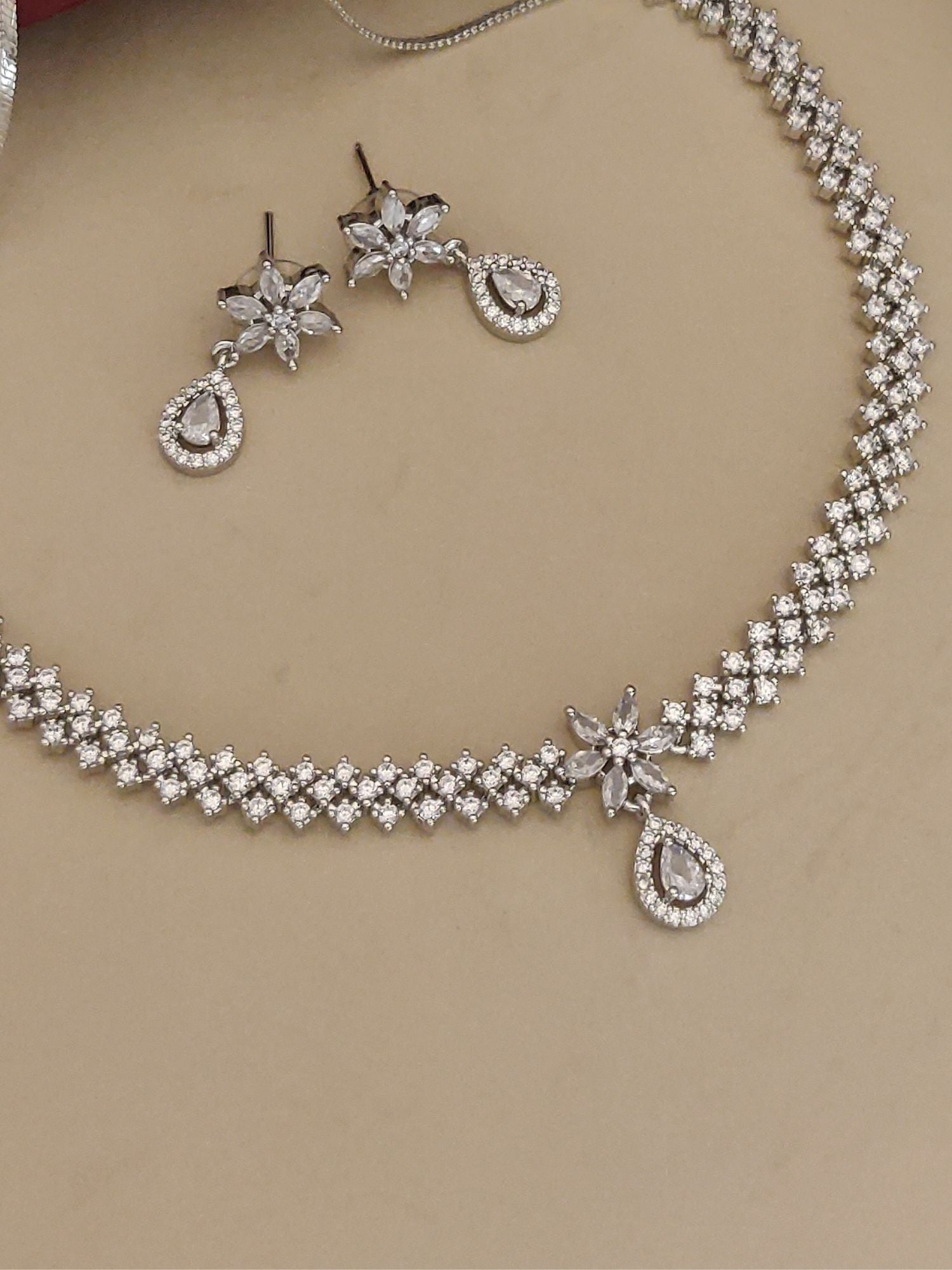 Silver plated American diamond necklace set with matching floral and teardrop earrings by Abdesignsjewellery
